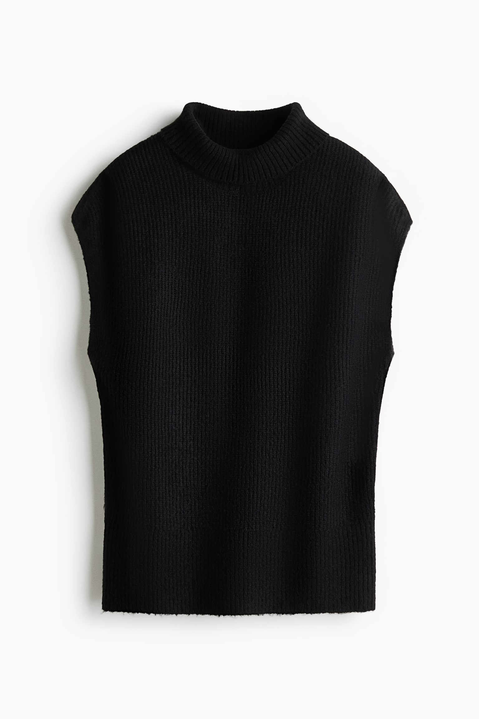 A black long jumper in a soft rib knit is facing front, showcasing a ribbed roll neck, short cap sleeves, and a straight hem. The garment features a consistent vertical ribbed texture throughout the body and collar.