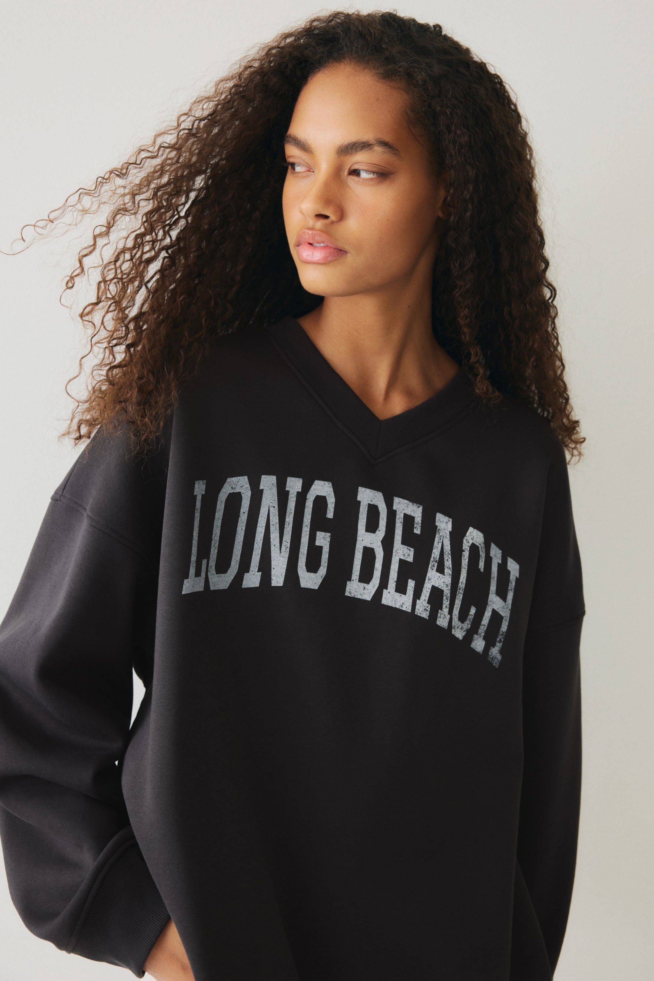 View larger image: Oversized V-neck sweatshirt - Dark grey/Long beach - Ladies | H&M IE 1