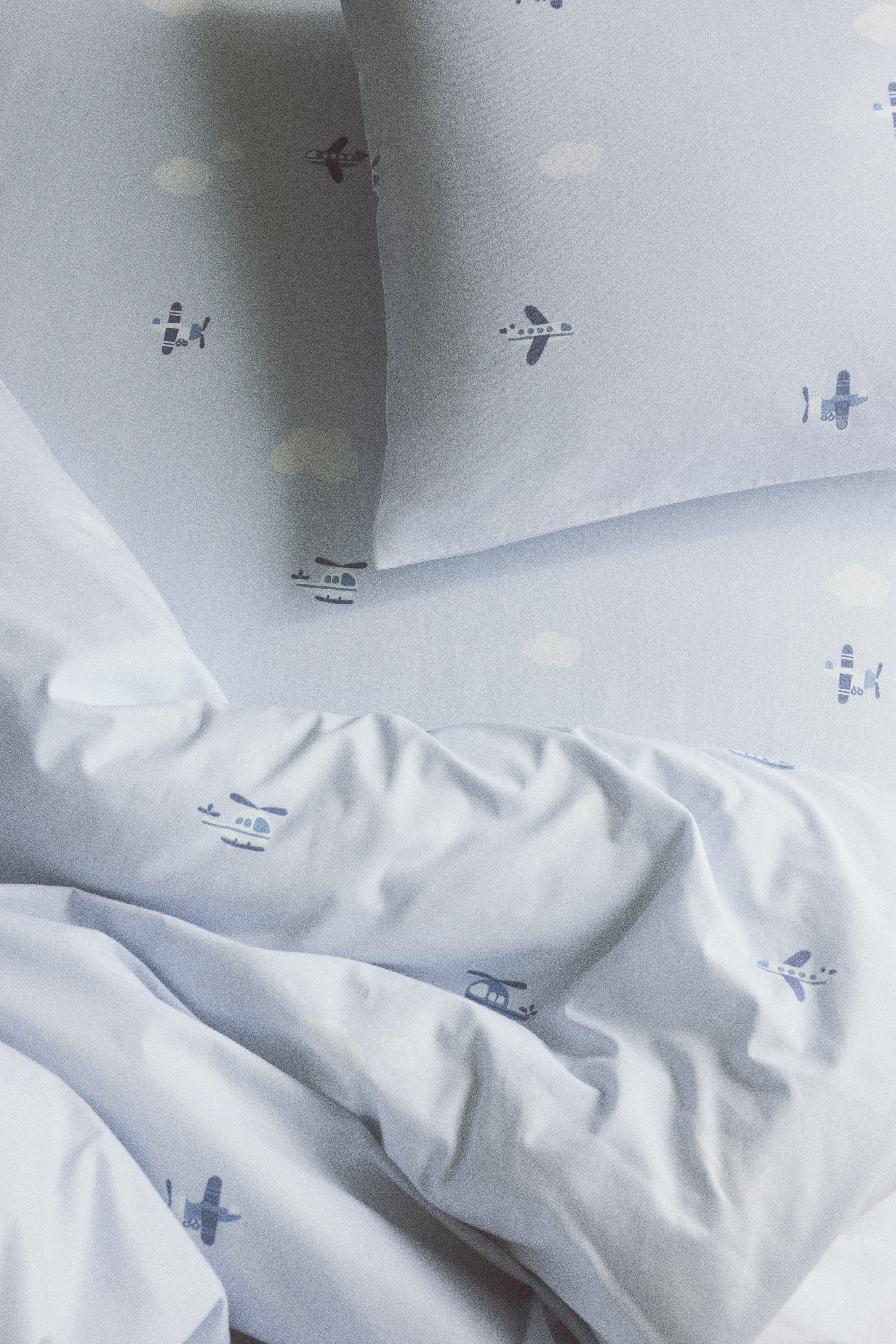 Patterned Cotton Fitted Sheet - Light blue/planes/White/cherries/Pink/floral/White/hearts/Cream/floral/Light blue/fish/Light beige/dinosaurs/White/dotted/Light beige/unicorns/Light taupe/floral/Light green/vehicles/Light pink/floral/Light yellow/oranges/Green/clover
