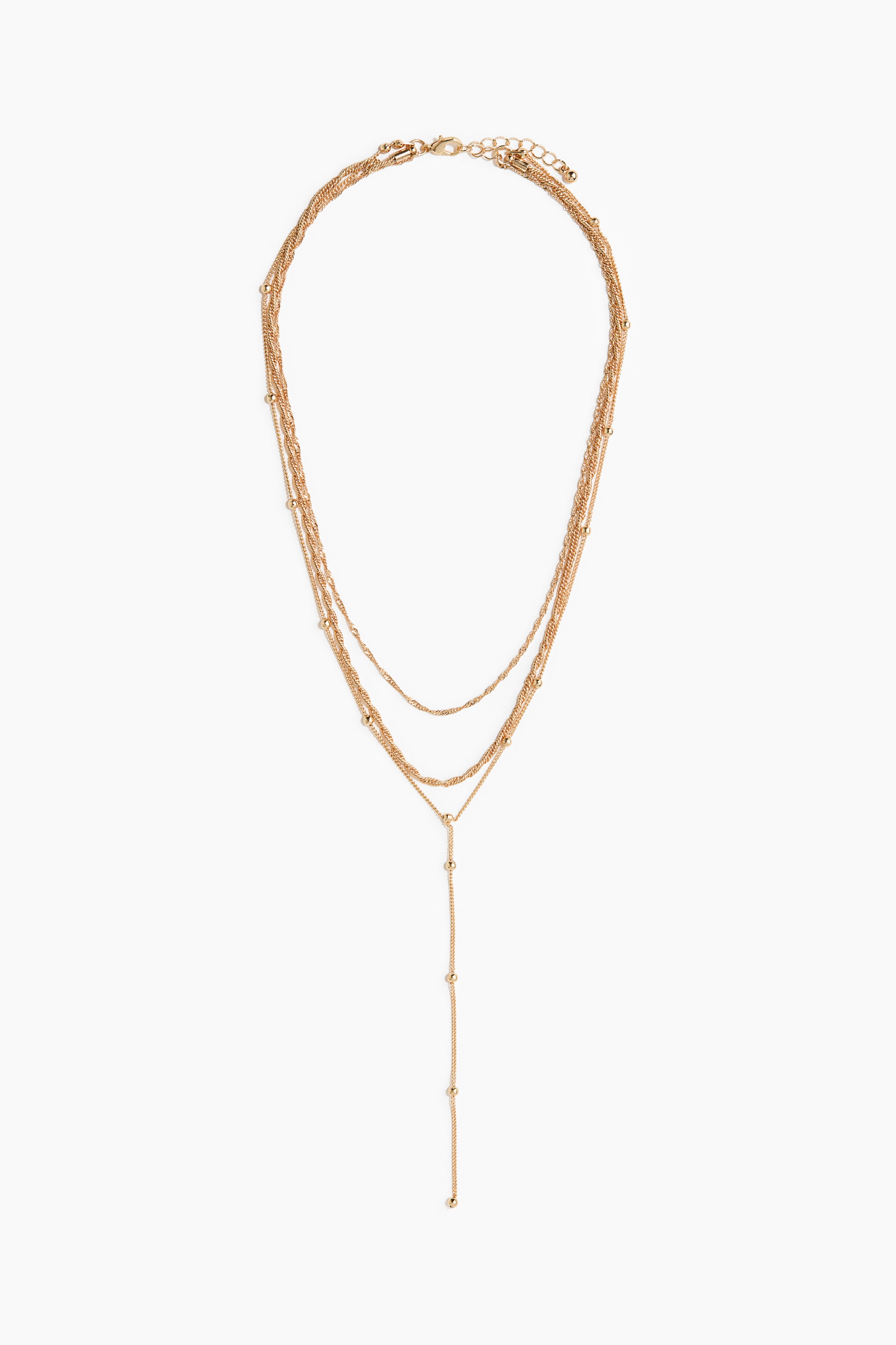 A layered metal necklace is displaying three chains in various designs, including a Y-shaped dot chain, and is featuring an adjustable length with a trigger clasp.