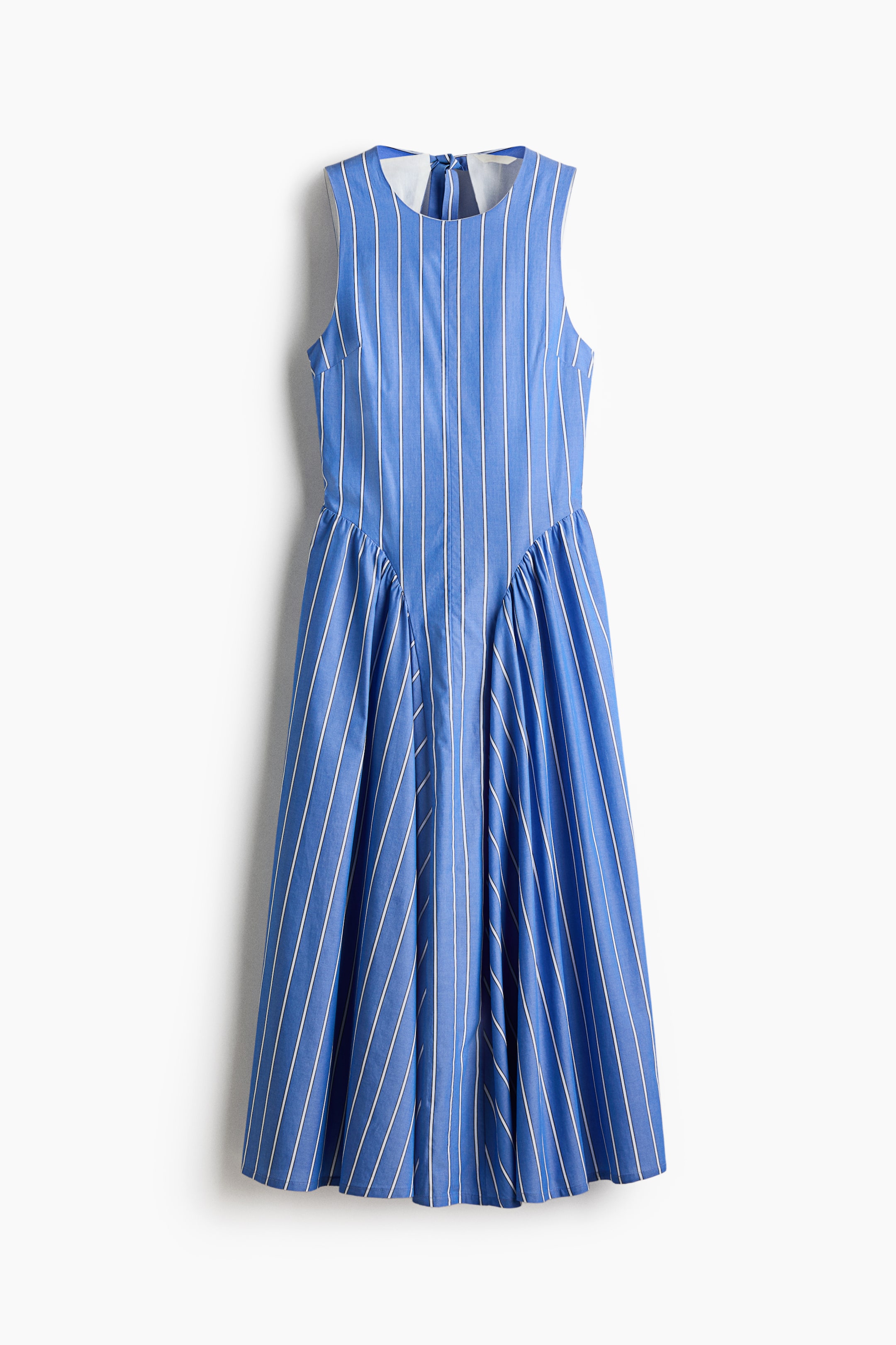 View larger image: A blue and white striped sleeveless midi dress is showcasing its front, featuring a fitted bodice and a full, flared skirt with gathered panels. Vertical white stripes detail the fabric, and a small keyhole opening is visible at the back of the neck.