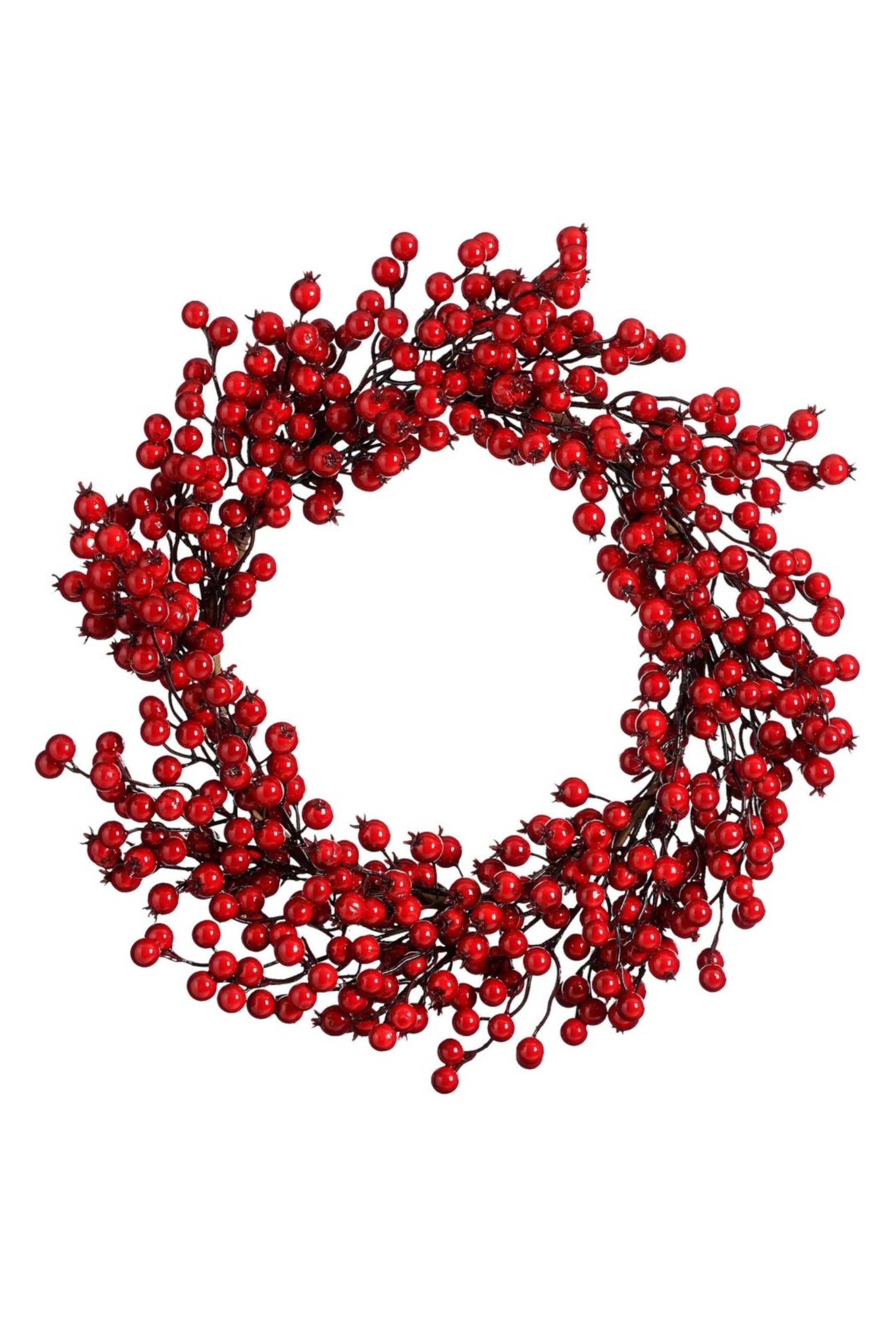 Ver imagen más grande: Una corona navideña circular presenta una densa composición de brillantes bayas rojas adheridas a finas ramas marrones de aspecto similar a ramitas. La corona, vista de frente, muestra un centro hueco con numerosos grupos de bayas que se extienden hacia afuera para crear un diseño voluminoso y ტექsturizado.