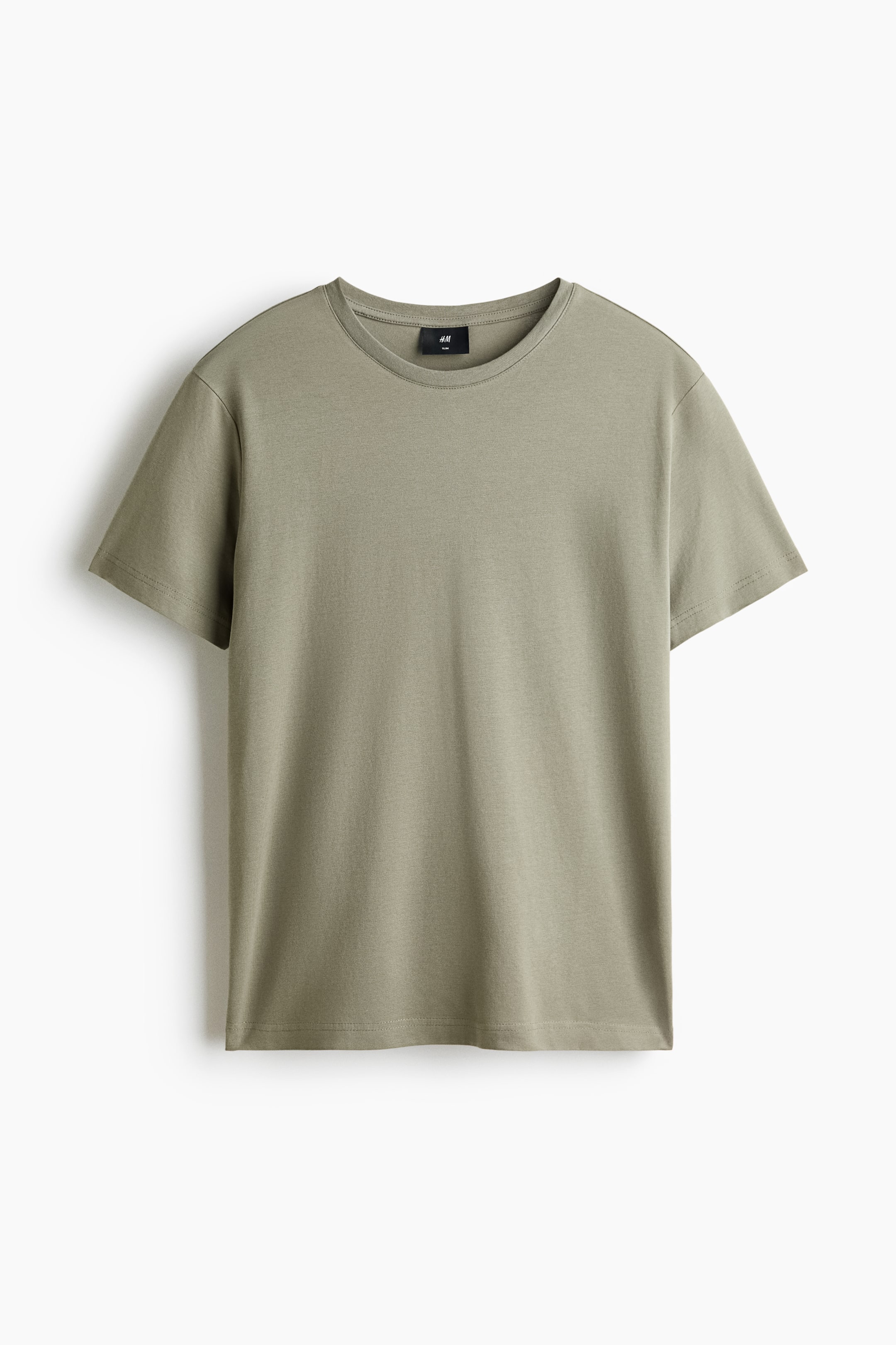 View larger image: The olive green T-shirt is laid flat, shown from the front. It features a crew neckline, short sleeves, and a straight hem. A black H&M brand label is visible on the inner back collar.