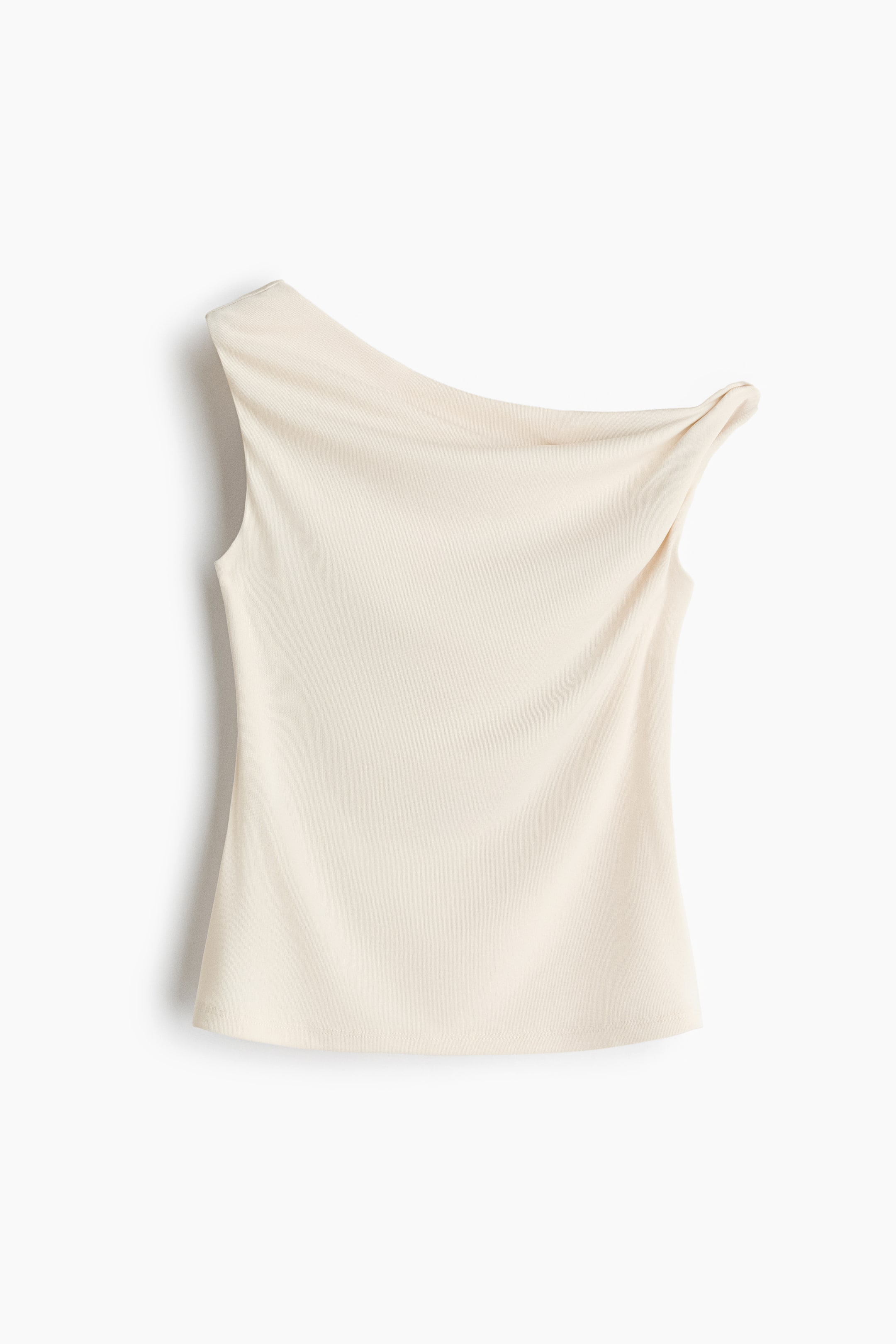 View larger image: A cream-colored sleeveless top is presented FRONT, featuring a one-shoulder design with a draped neckline on the right side and a plain sleeveless finish on the left. The top is made from a smooth fabric with a subtle texture and is cut straight at the hem.