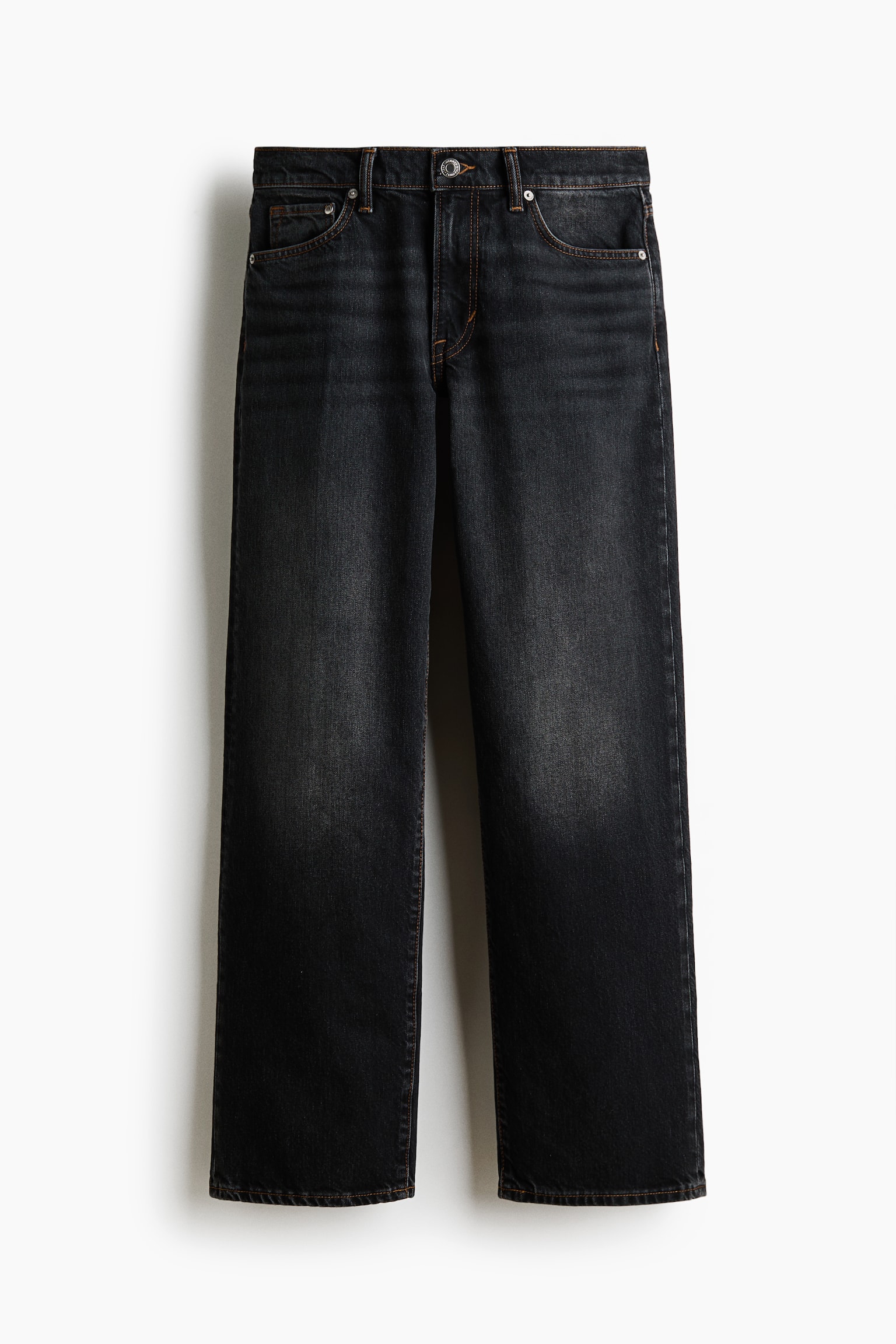 The dark grey, straight-leg jeans are displaying a faded wash on the front, with a button closure and metal rivets on the pockets. They are featuring visible contrast orange stitching throughout. - 1