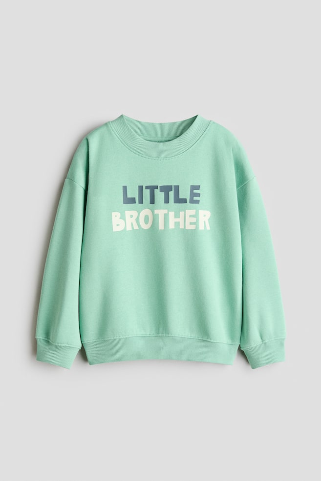 Sudadera con motivo estampado e interior cepillado - Turquesa/Little Brother/Verde jaspeado/Big brother/Azul empolvado oscuro/Mom/Rojo oscuro jaspeado/Dad - 1
