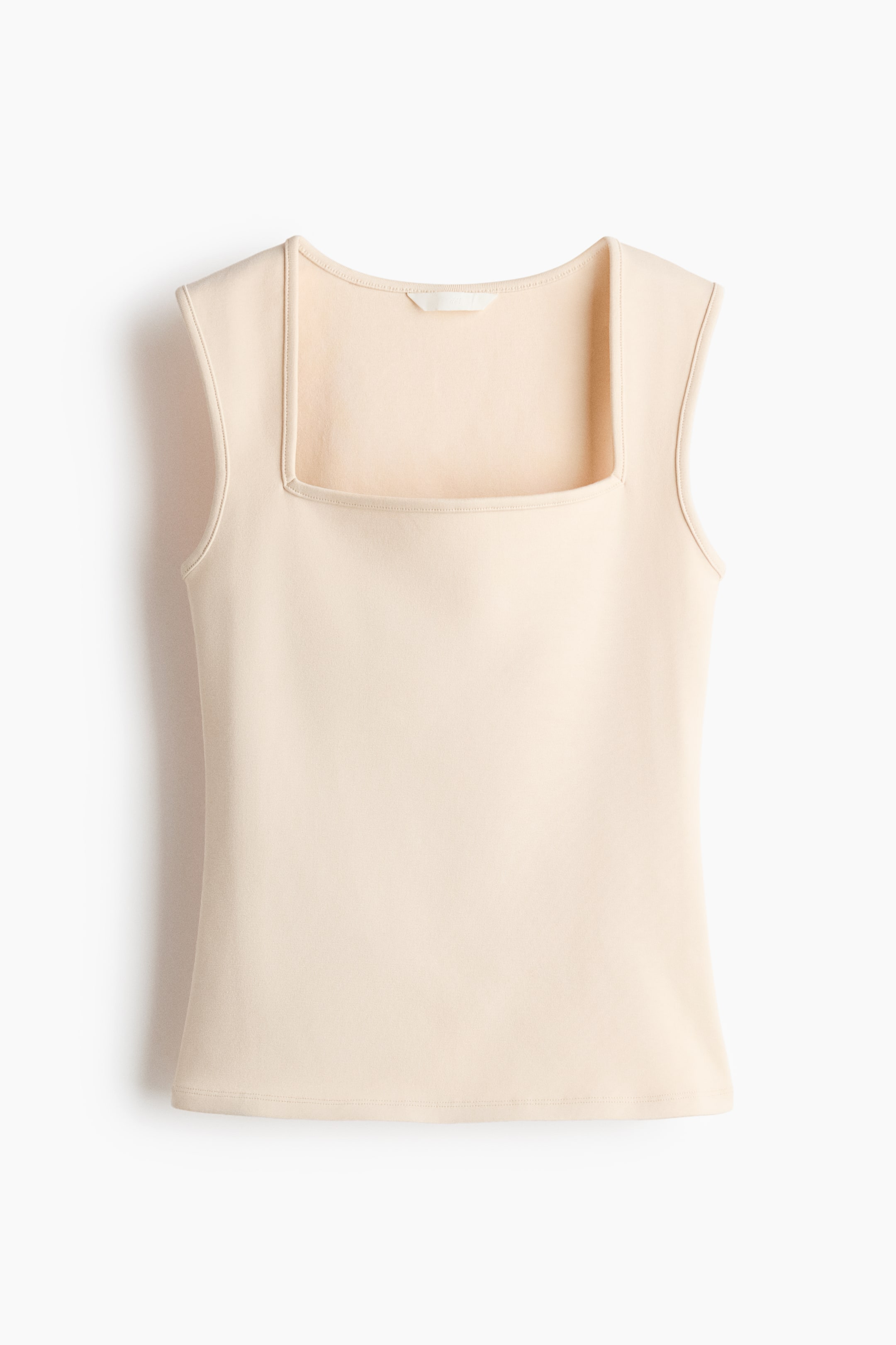View larger image: A light beige sleeveless top is displayed front-facing, showcasing a square neckline and a smooth texture. The top is crafted with armholes and a straight hem.