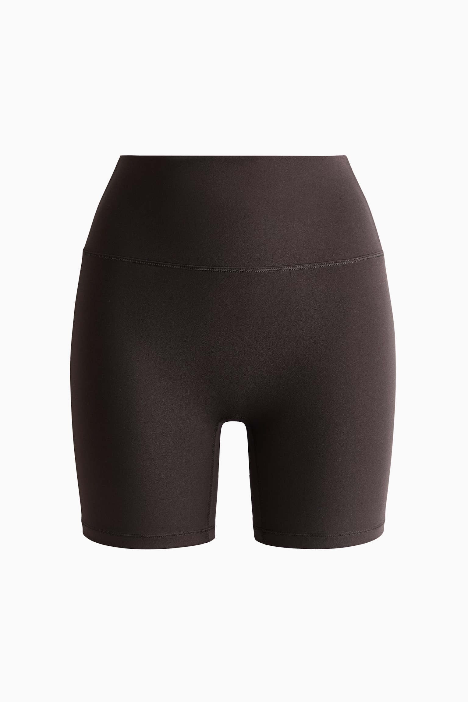 High-waisted bike shorts in a dark brown shade feature a fitted, mid-thigh silhouette with a wide, supportive waistband.