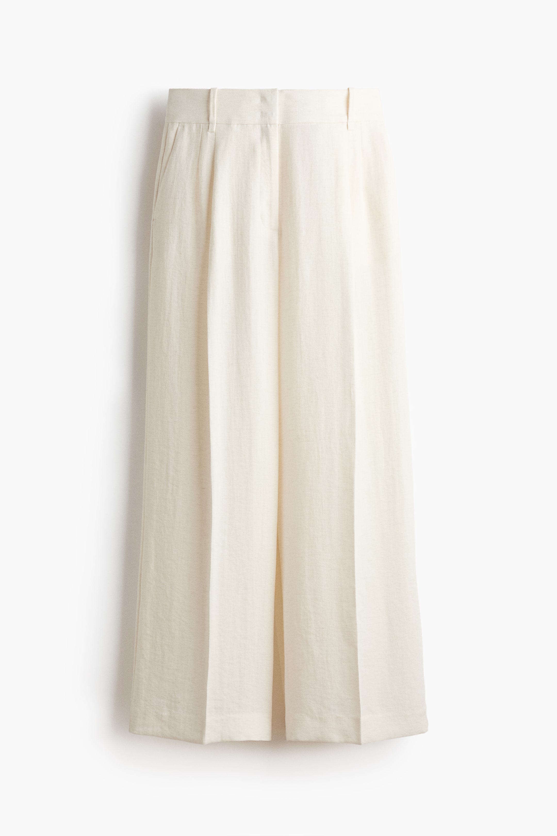 View larger image: The cream-coloured wide-leg trousers are facing front, featuring a lightweight, textured fabric and a flat waistband with belt loops. They are showcasing two front pleats on each leg, side pockets, and a cropped length with a straight hem.