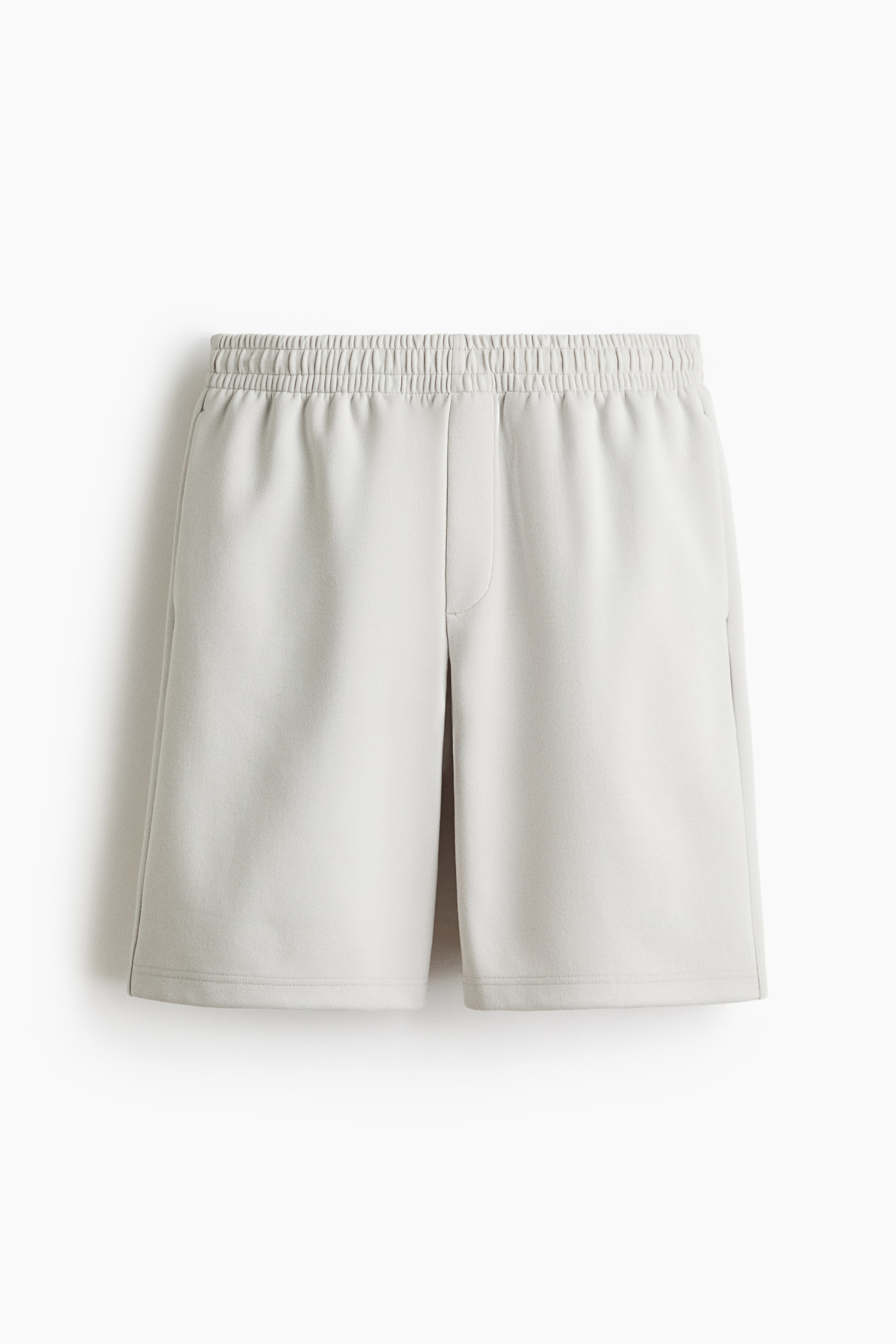 View larger image: Light grey shorts, shown from the front, feature a smooth texture, an elasticated waistband, a centre-front seam, side-seam pockets and a straight hem.