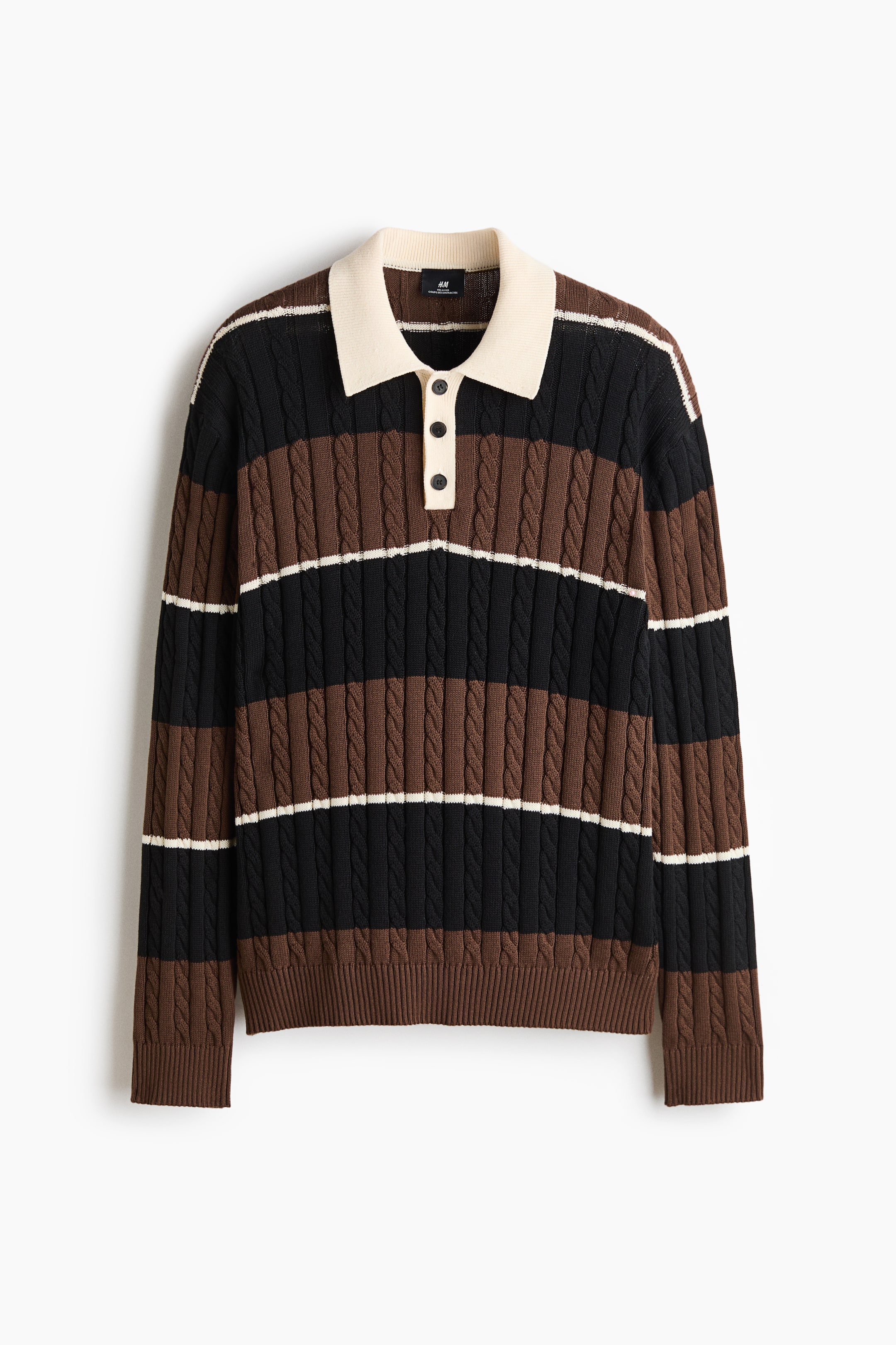View larger image: A long-sleeved cable-knit polo sweater is shown from the front, featuring wide horizontal stripes in black and brown separated by thin white lines. It has a contrasting cream-coloured collar and three-button placket, with ribbed cuffs and a ribbed hem completing the design.