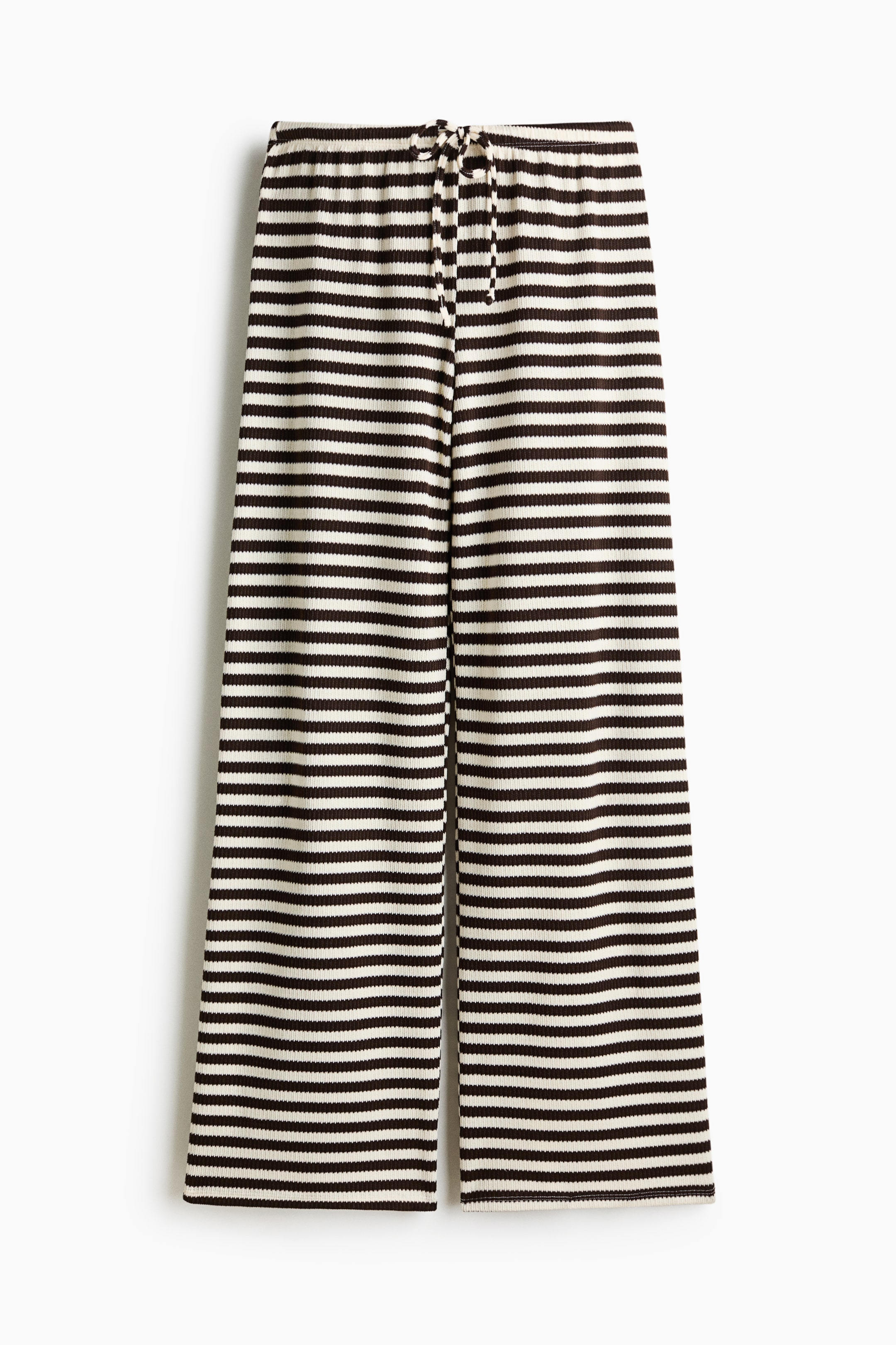 View larger image: Pants feature horizontal dark brown and off-white stripes on a ribbed knit texture. The front view shows an elasticated waistband with a tied drawstring.