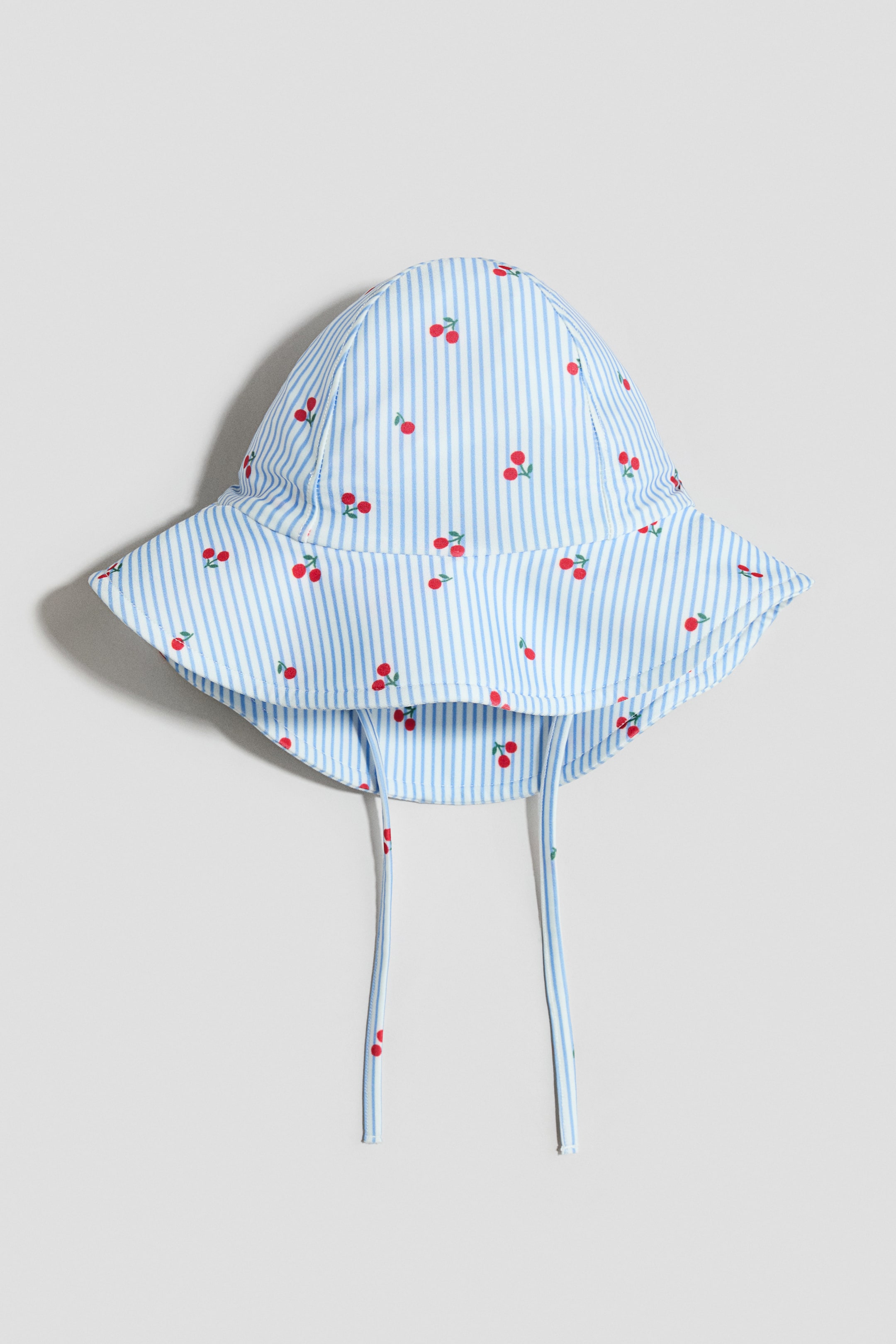 Visualizza immagine più grande: Cappello per il sole UPF 50 - Azzurro/ciliegie - BAMBINO | H&M IT 1