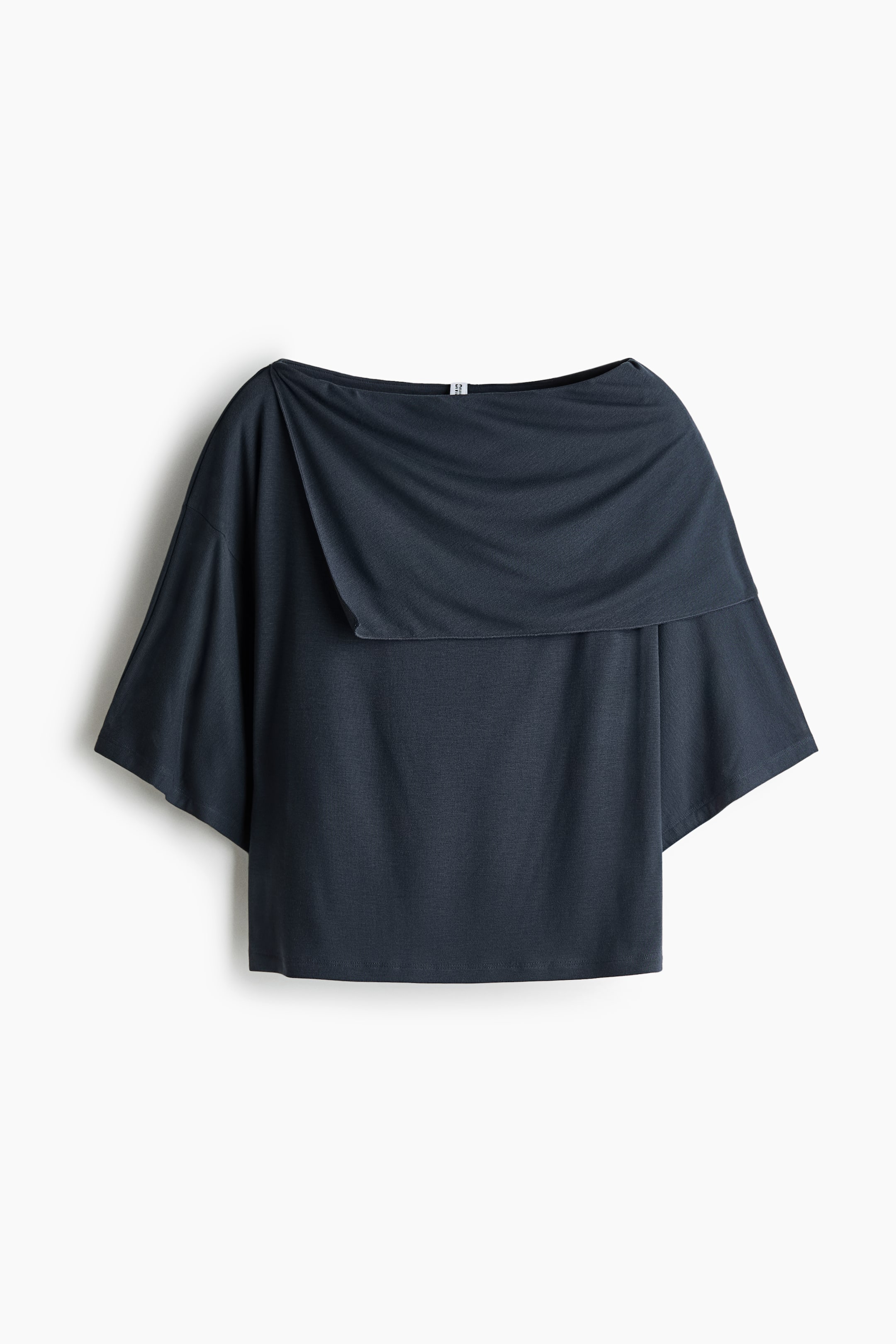 View larger image: A short top, presented FRONT, features a boat neckline, an asymmetric cape-look layer at the top, dropped shoulders, and short, wide sleeves.