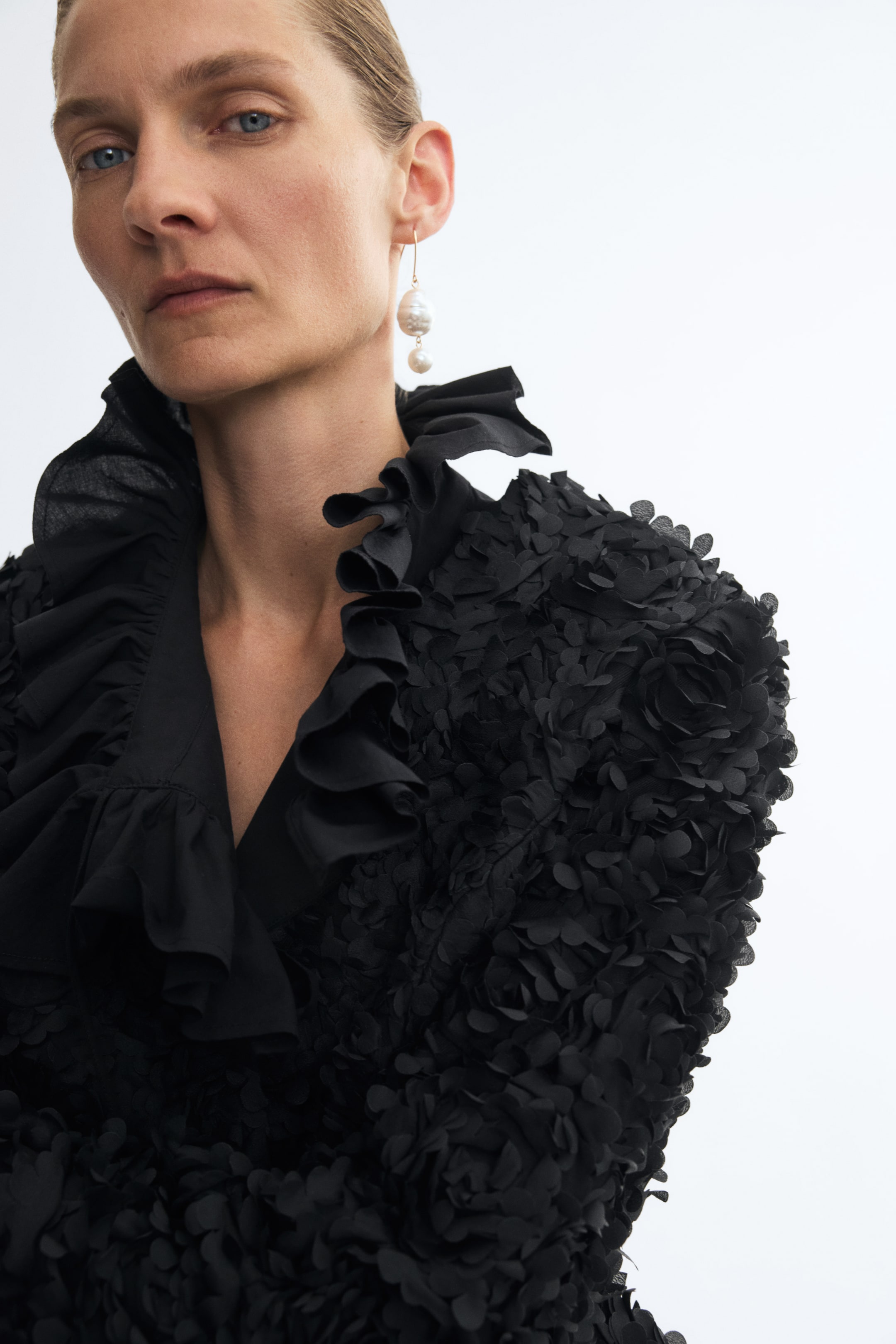 Blazer péplum avec appliqués