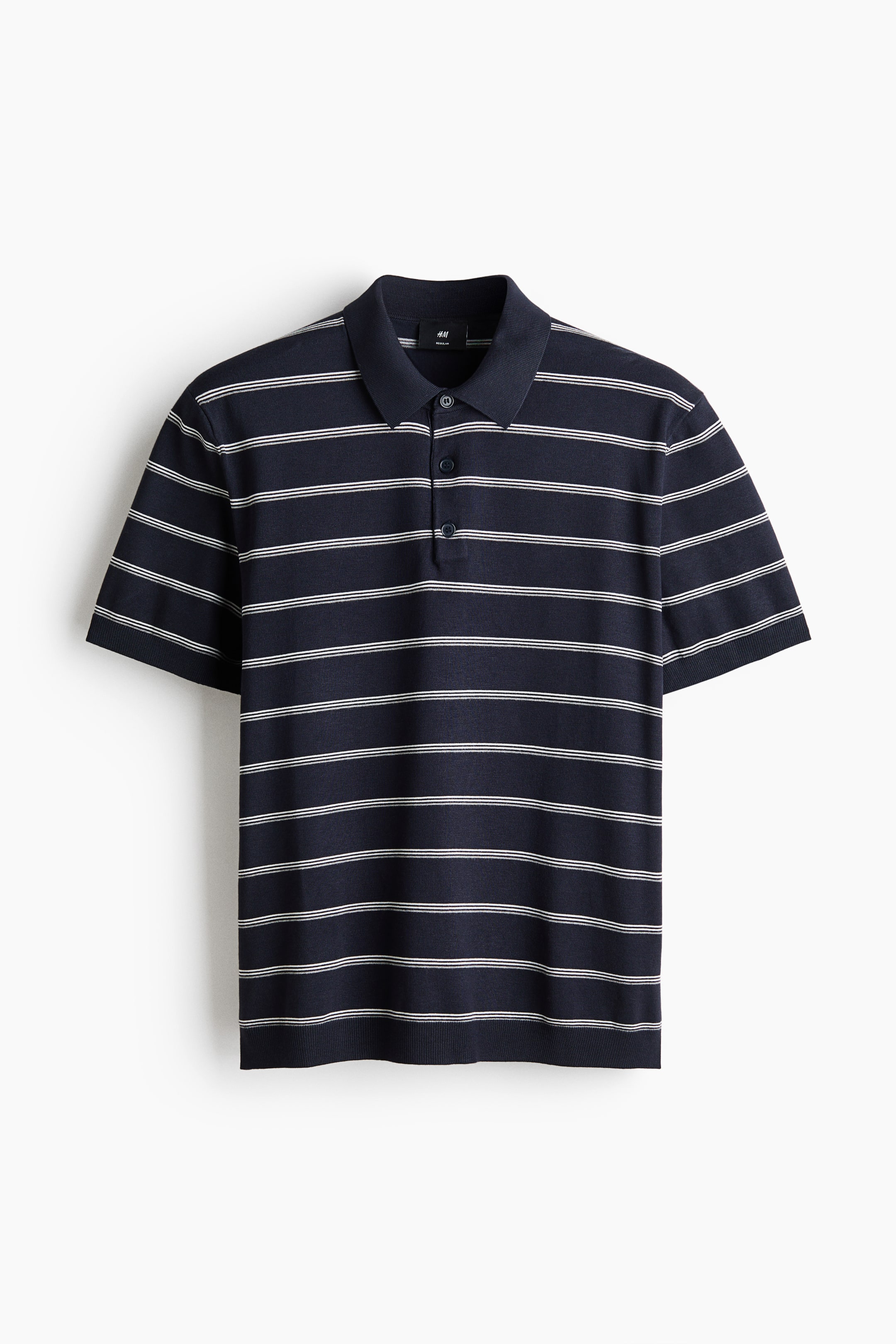 View larger image: A navy blue knit polo shirt is shown from the front, featuring thin horizontal white stripes across the body and short sleeves, a classic collar, a three-button placket, ribbed cuffs, and a ribbed hem.