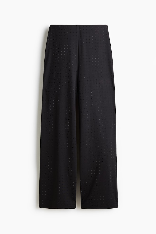 FRONT view of black wide-leg pants. The pants are featuring a subtle pin-dot texture throughout the fabric. - 1