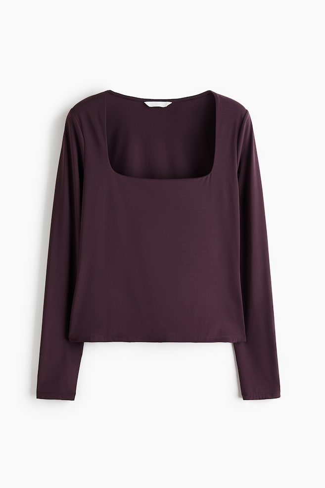 A dark purple long-sleeved top featuring a deep square neckline and a fitted silhouette from the front. The top is made from smooth, solid ponte fabric with clean-finished hems. - 1