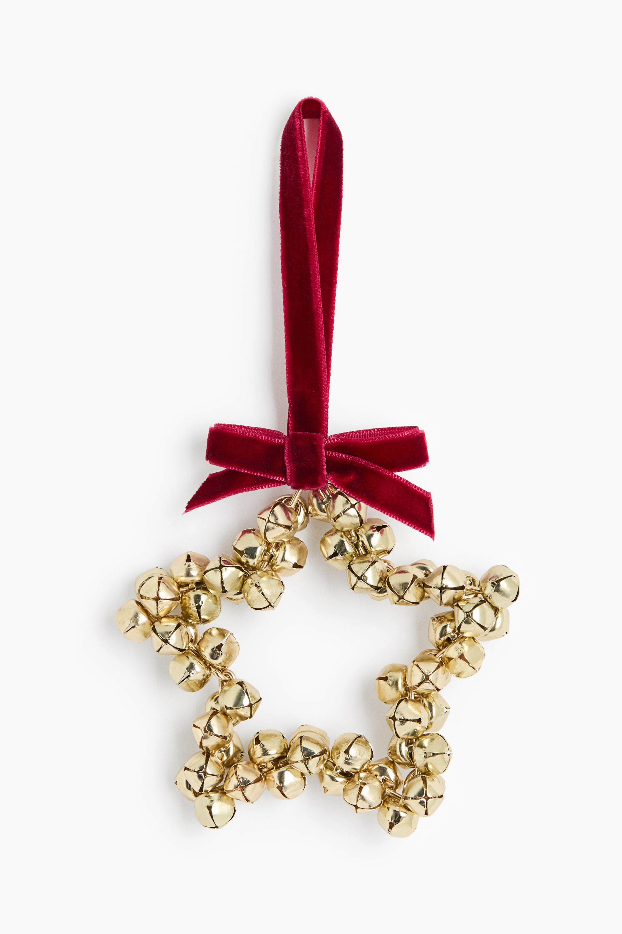 View larger image: A star-shaped decorative ornament is showcasing a cluster of small, gold-coloured metal jingle bells. A deep red velour ribbon is tied into a bow at the top, forming a vertical loop for hanging.
