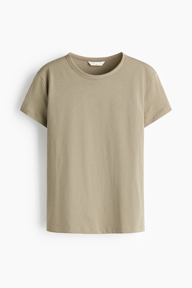 A khaki t-shirt is showcasing its front view, featuring a ribbed crew neck, short sleeves, and a straight hemline. A small white label is visible at the back of the neck. - 1
