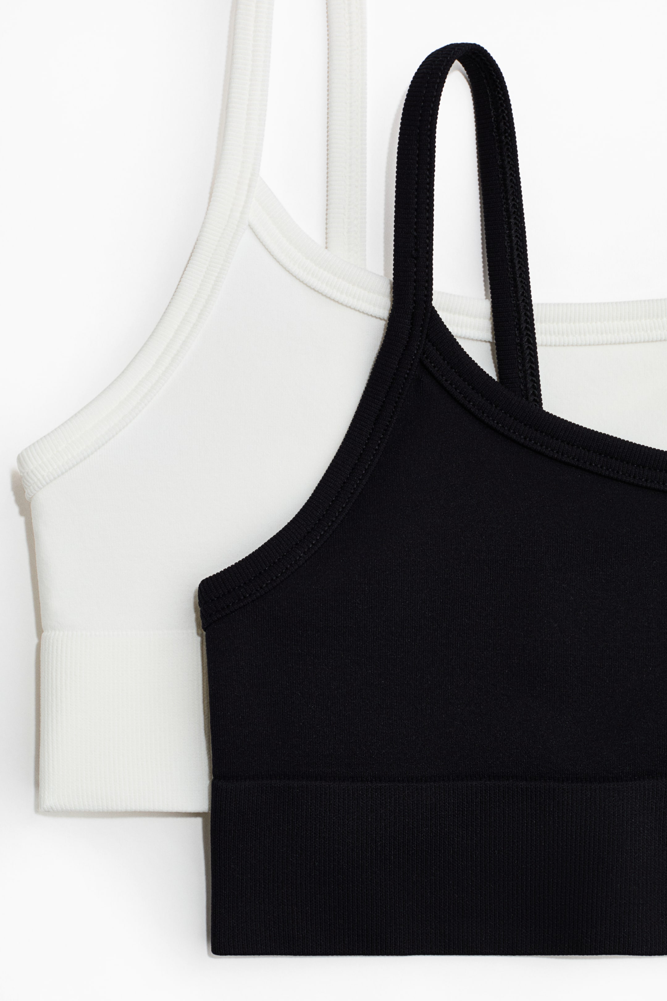 Ampliar la imagen: 2-pack Tops deportivos Seamless con DryMove™ - Negro/Blanco - Kids | H&M MX 2