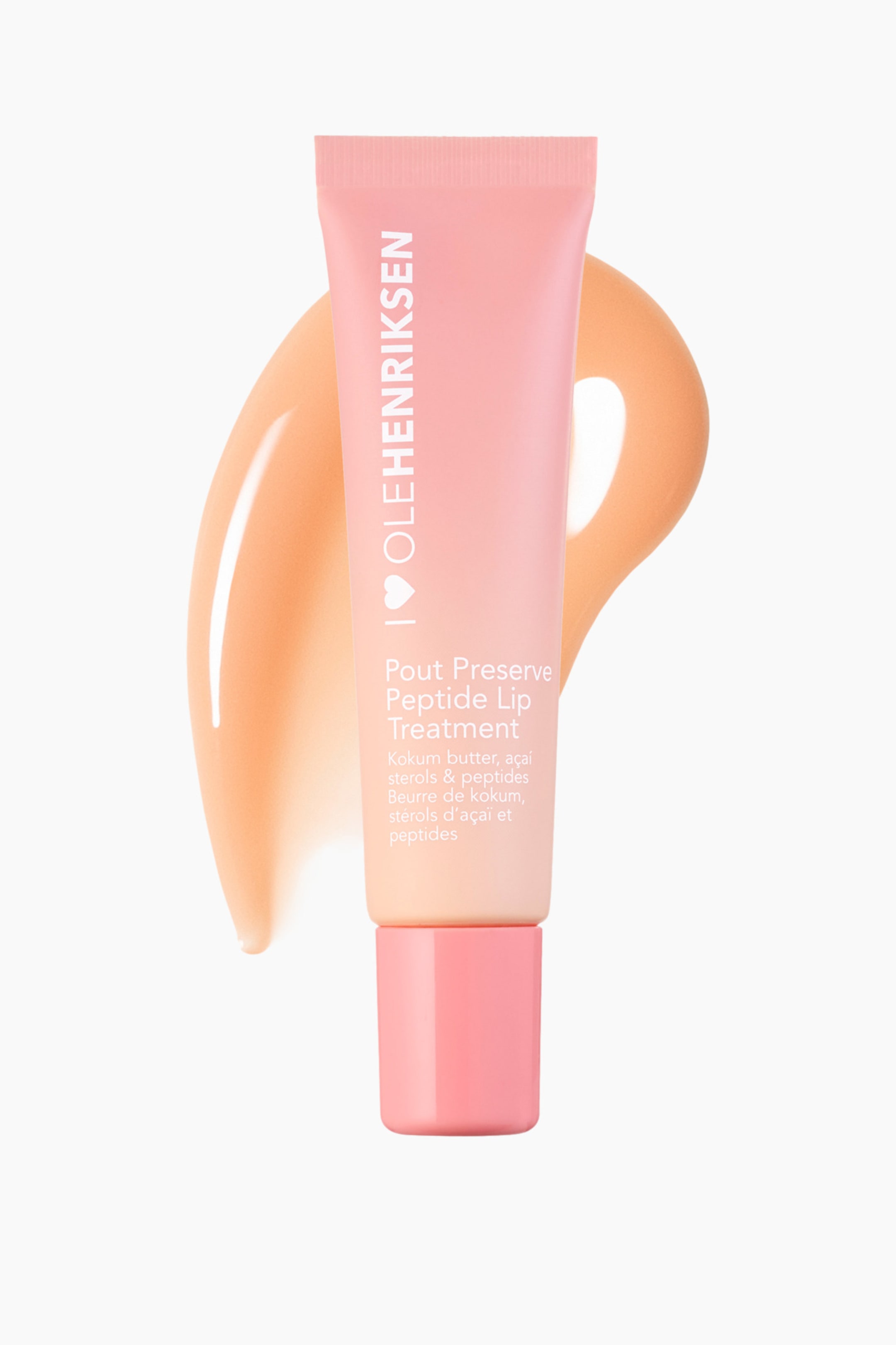 Vis større bilde: Et OLEHENRIKSEN Pout Preserve Peptide Lip Treatment-rør står oppreist, lett vinklet mot høyre, og viser et ombré-design fra rosa øverst til fersken nederst. Røret har en rosa sekskantet hette og synlig produkttekst på forsiden, med en ferskenfarget produktstrøk bak det.