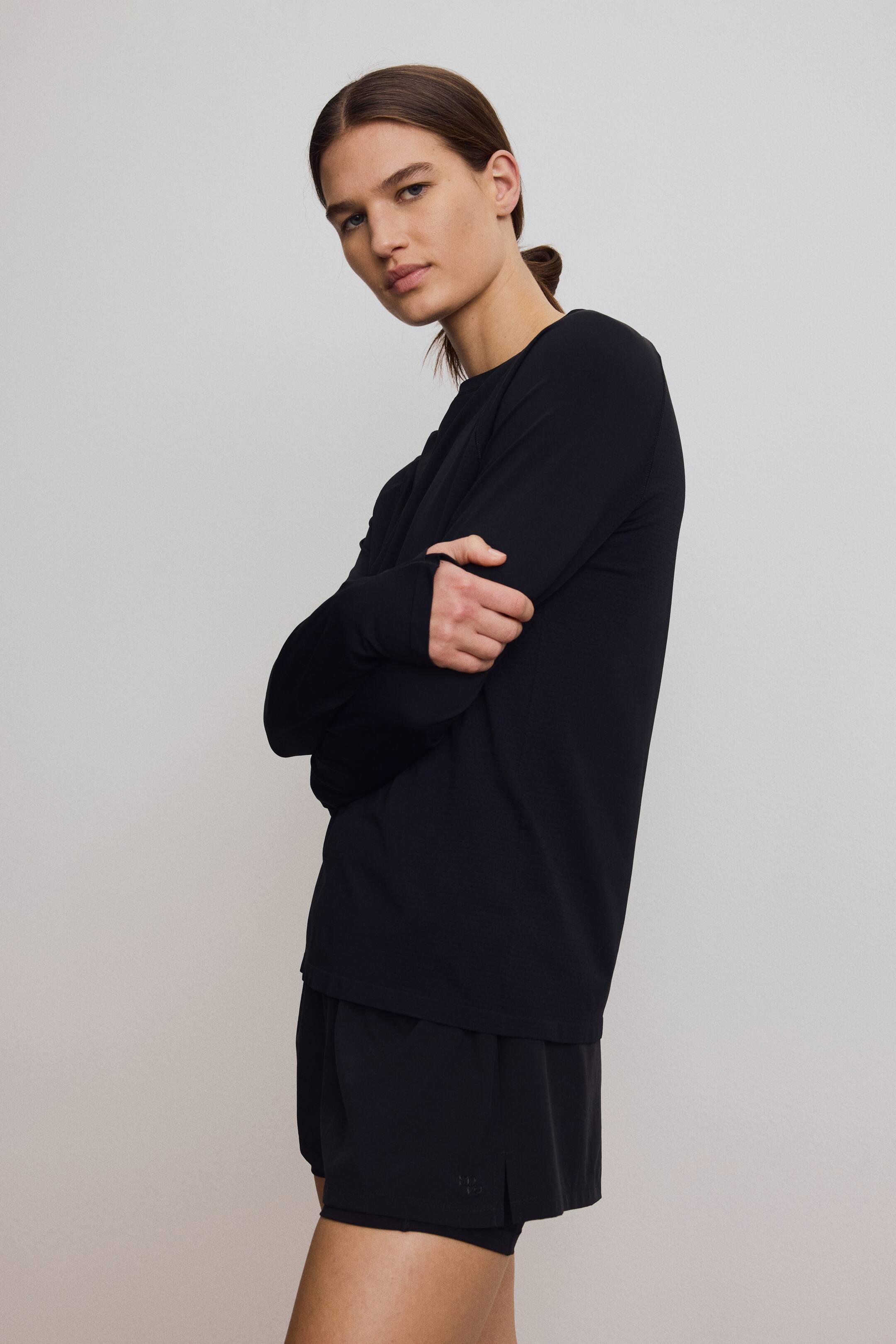 Grotere afbeelding bekijken: Seamless sporttop met DryMove™ - Zwart - DAMES | H&M BE 1