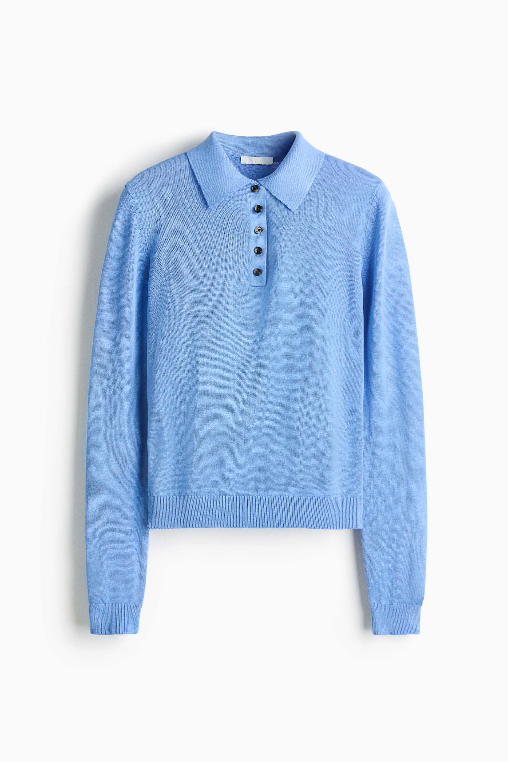 View larger image: A light blue knitted polo shirt is showcasing its front, featuring a pointed collar and a four-button placket with dark, round buttons. It's crafted with long sleeves, ribbed cuffs, and a ribbed hem.