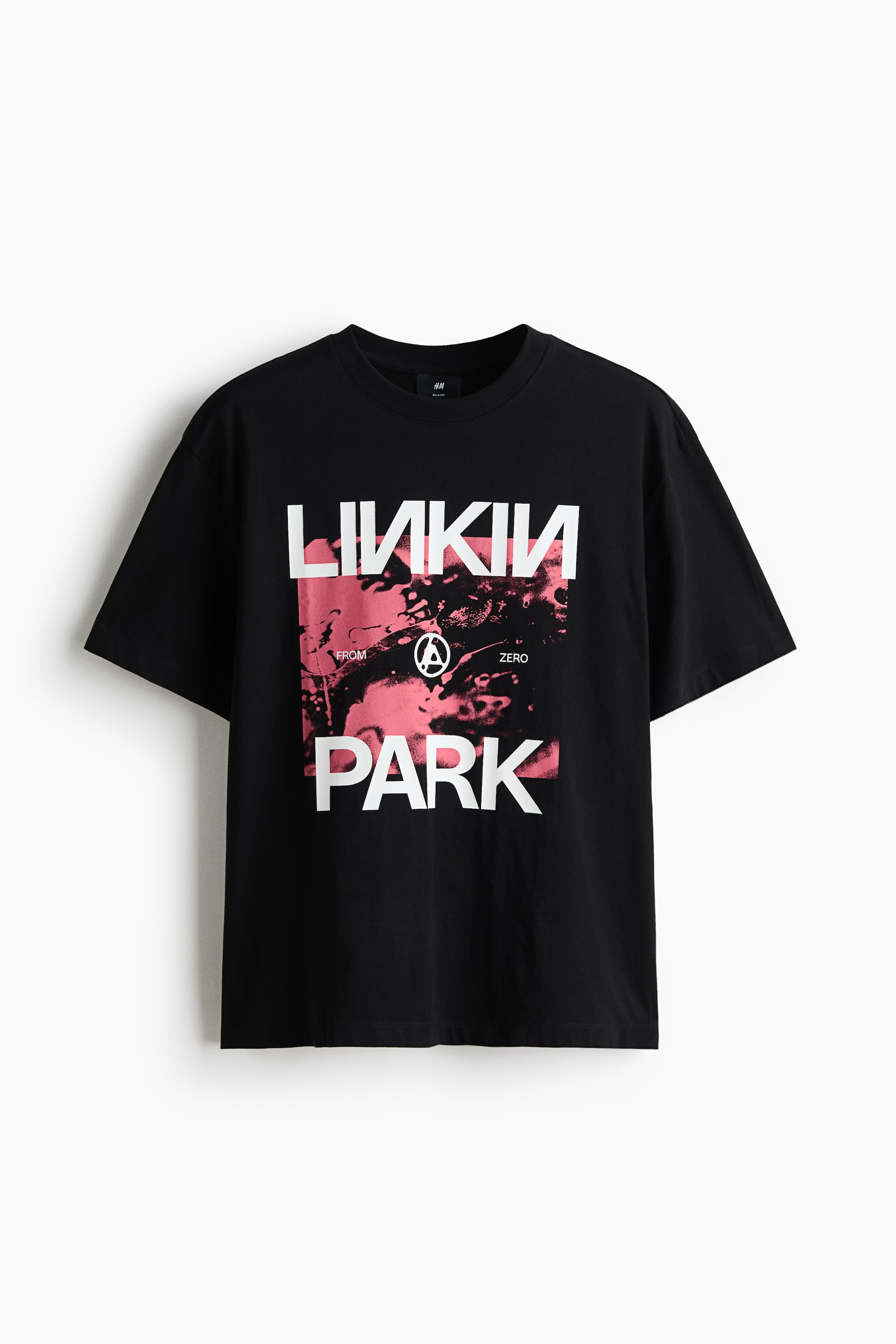 View larger image: A black cotton jersey T-shirt featuring a round, rib-trimmed neckline, dropped shoulders, and a straight-cut hem, presented with a loose fit. The front displays a white 'LINKIN PARK' print motif over a pink and black abstract graphic.