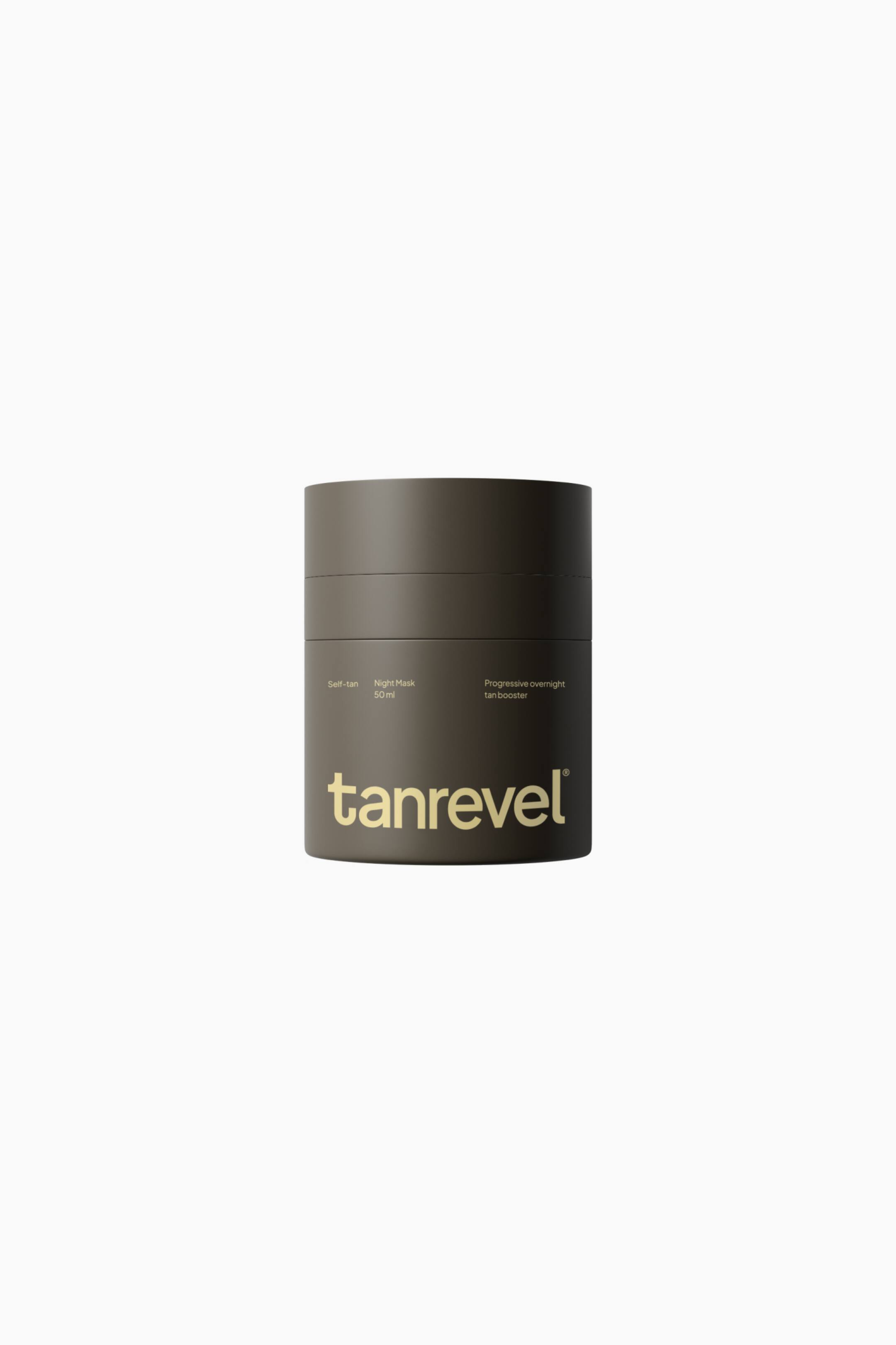Se større billede: Self Tan Night Mask fremstår som en elegant, cylindrisk krukke i mat mørkebrun, vendt direkte fremad. Den har et matchende låg i plan afslutning og gylden tekst, der viser brandnavnet "tanrevel" sammen med produktoplysninger nær bunden.