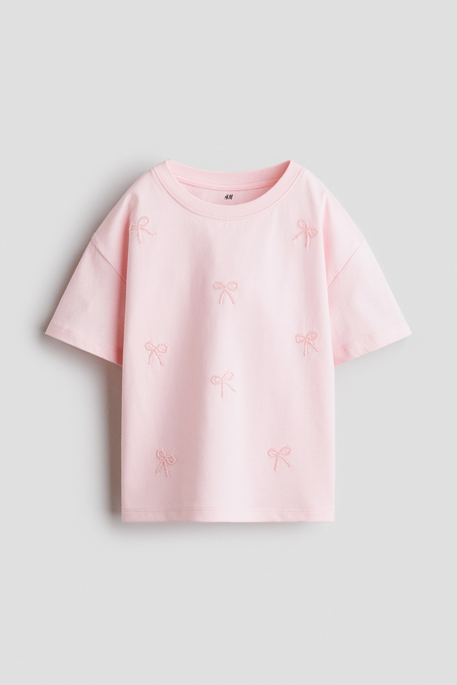 Áo thun bằng cotton đính trang trí - Màu hồng nhạt/Nơ/Màu ngà/Hoa/Màu trắng/Kẻ xanh tím than/Màu kem/Nơ/Coral pink/Le Marais/Màu ngà/Spread love