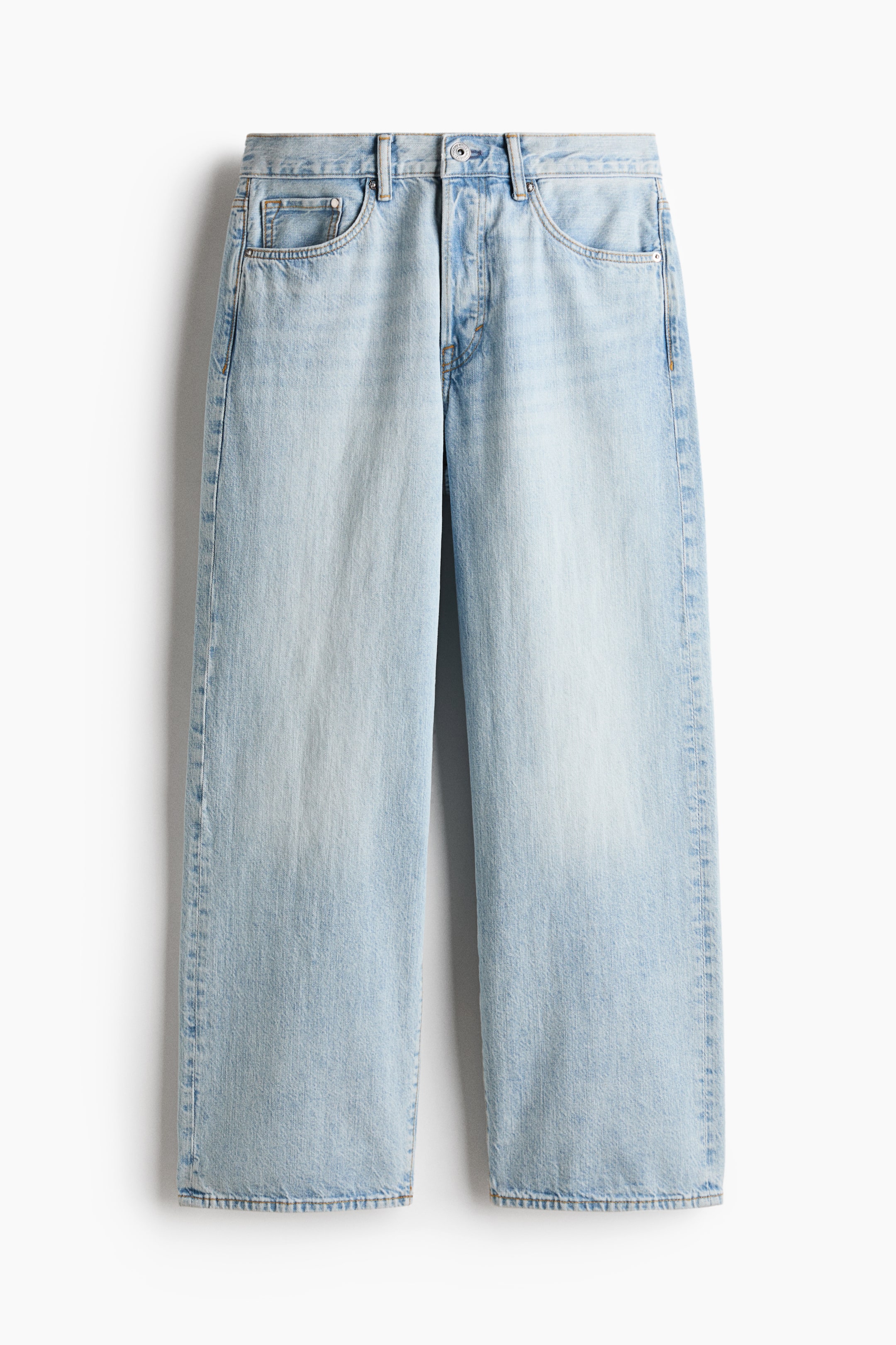 View larger image: Light wash straight-leg jeans are shown from the front, featuring a button and zipper fly closure, belt loops, and two scoop front pockets with a small coin pocket.