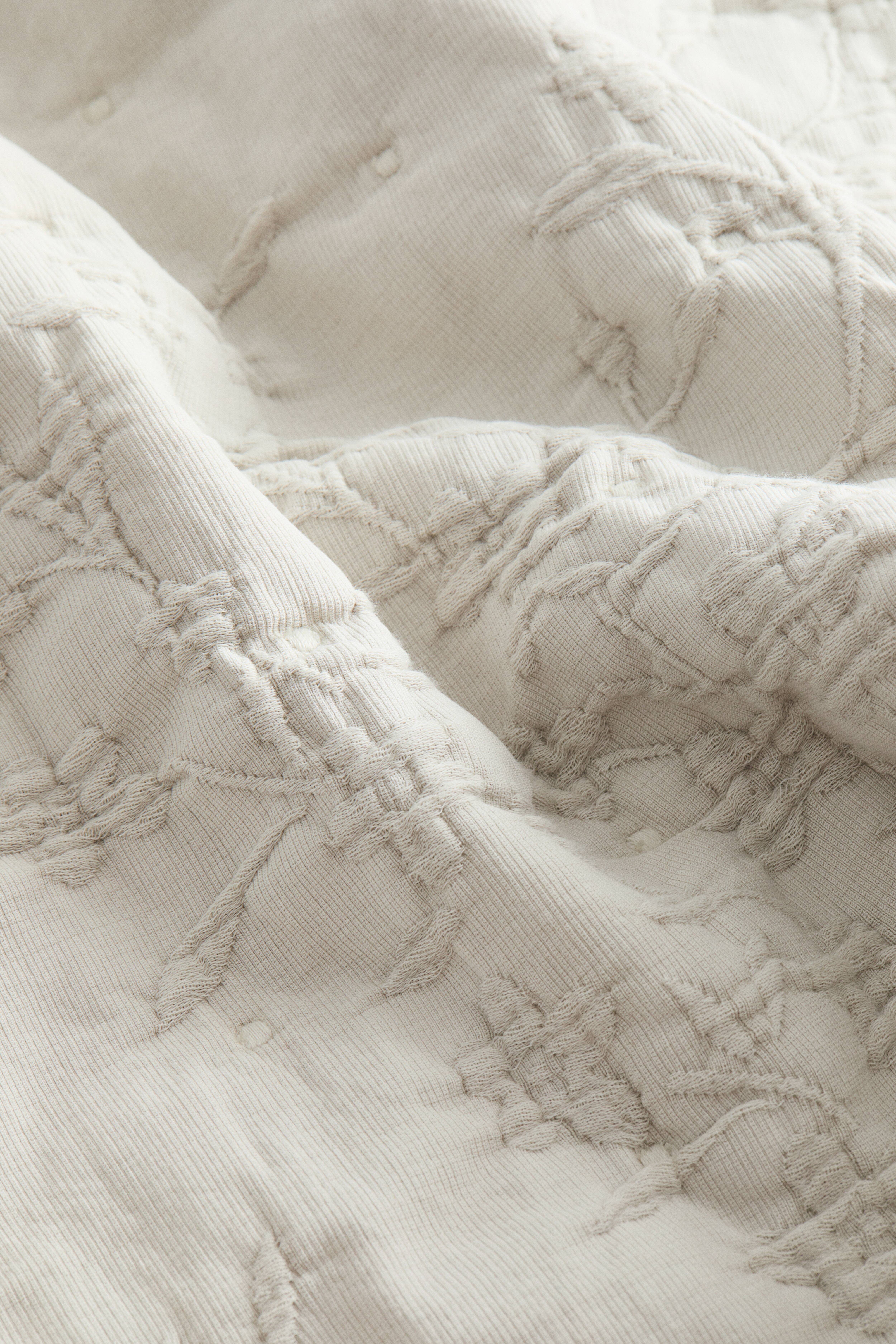 Housse de coussin en tissu jacquard