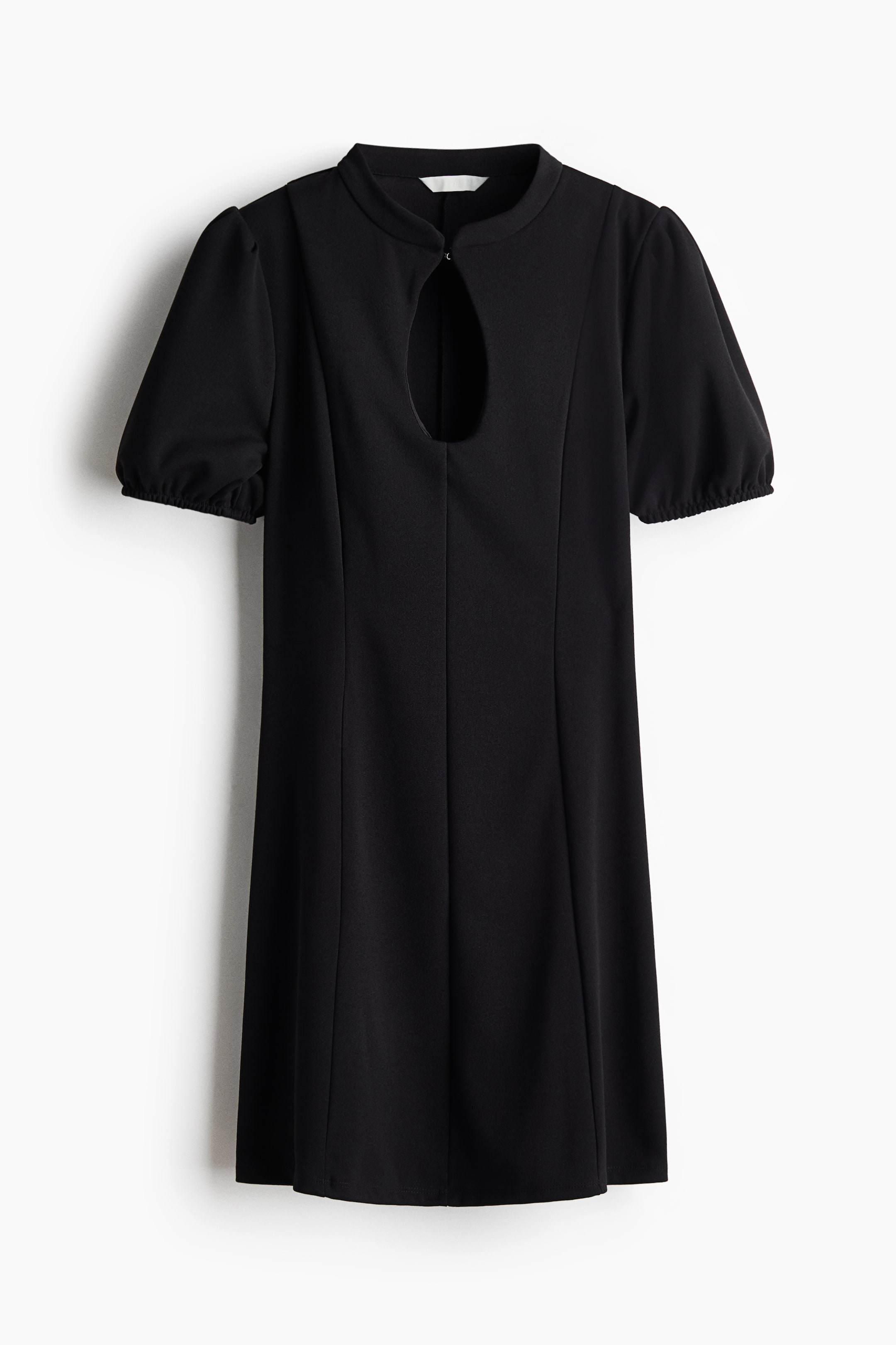 View larger image: A black mini dress is hanging front-facing, featuring a round neckline with a keyhole cutout at the chest and a hook-and-eye closure. The dress has short puff sleeves with elasticated cuffs, visible vertical seams down the fitted bodice, and a gently flared skirt.