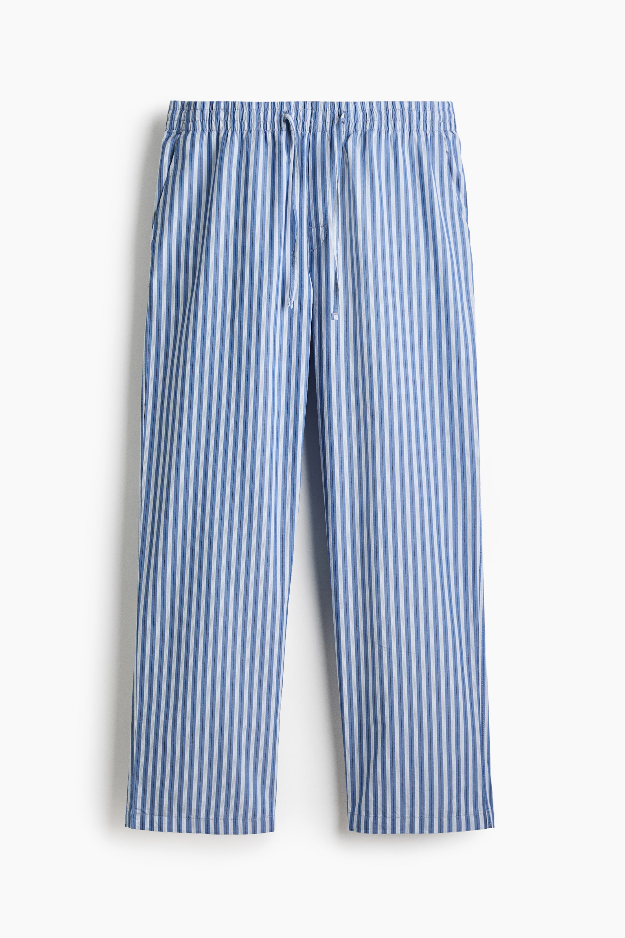 View larger image: The trousers are shown from the front, featuring blue and white vertical stripes. They come with an elastic waistband, a white drawstring, and side pockets, offering a relaxed fit.