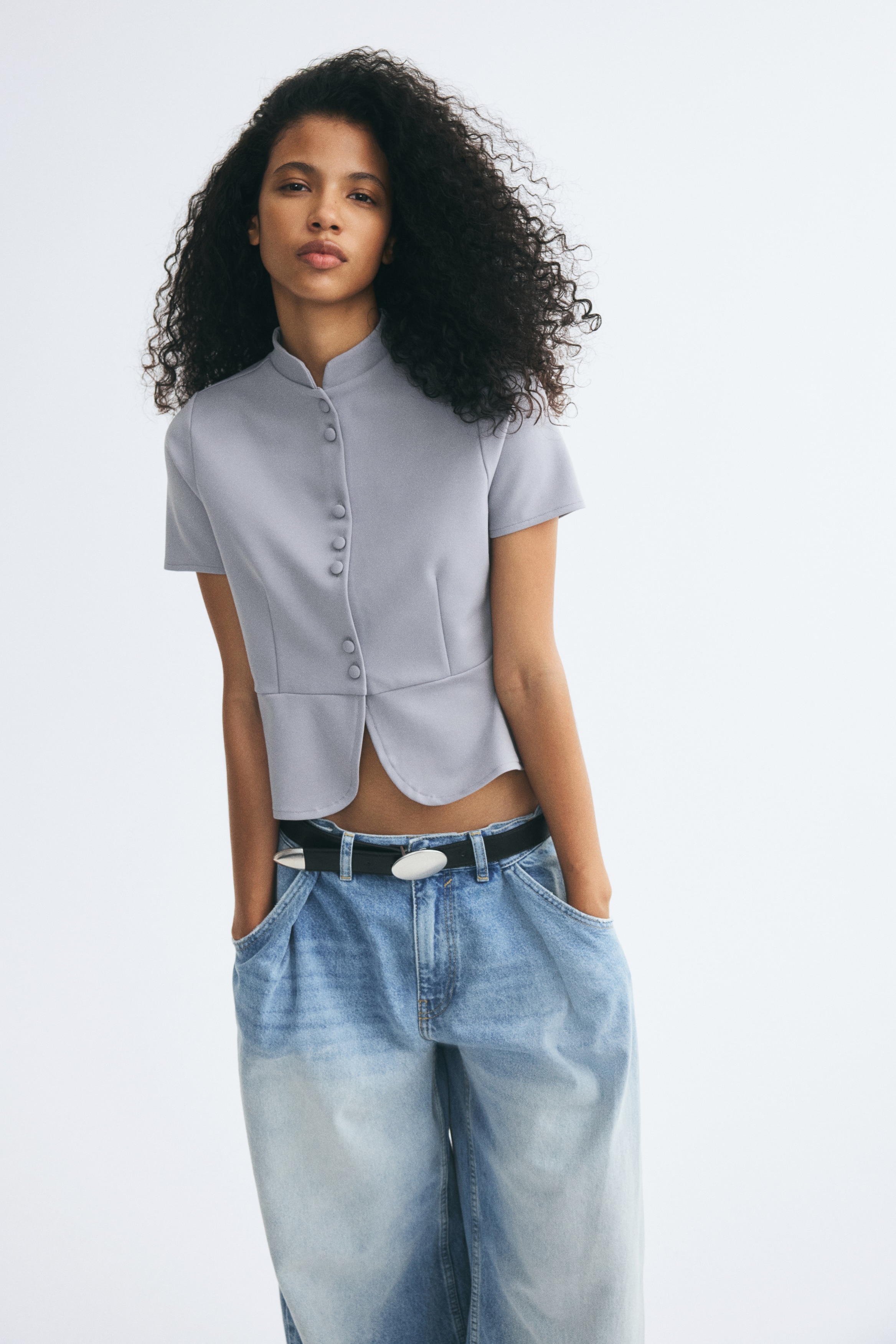 Top peplum con botonadura frontalAuxiliar