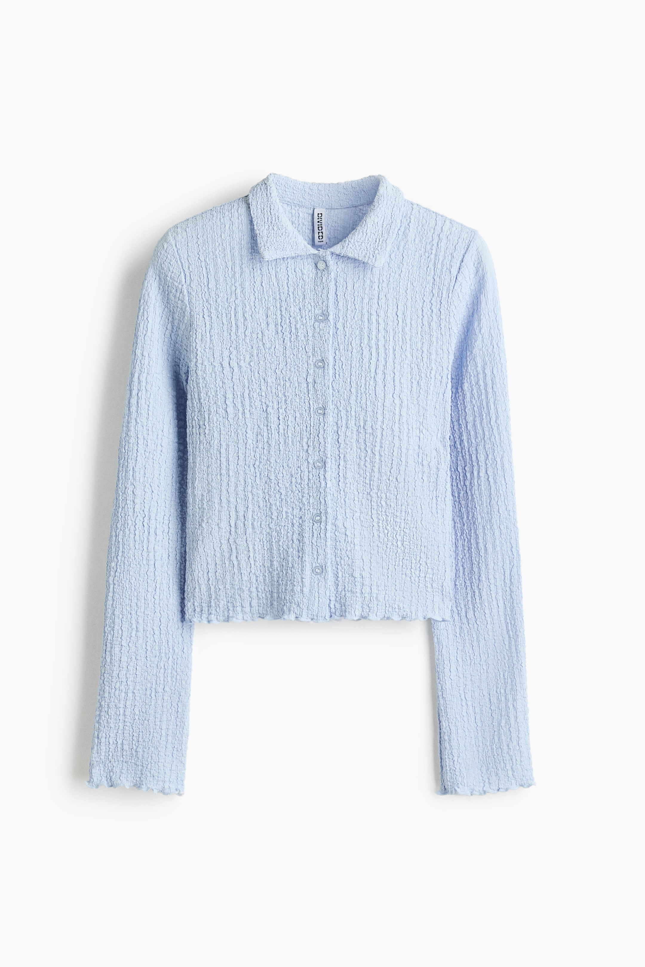 View larger image: A light blue crinkled cardigan is displayed from the front, featuring a pointed collar and a full button-down closure with light buttons. 