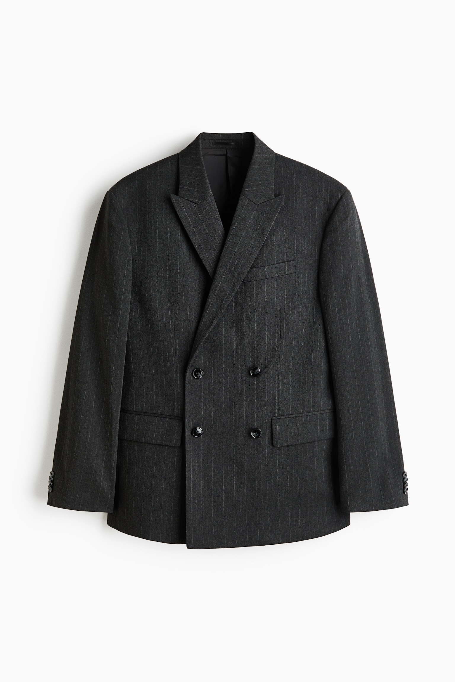 "A dark gray pinstriped double-breasted blazer is facing front, featuring wide peak lapels. It is displaying four black buttons in two rows on the front, two flap pockets at the hip, and one welt pocket on the left chest, with three smaller black buttons on each cuff." - 1