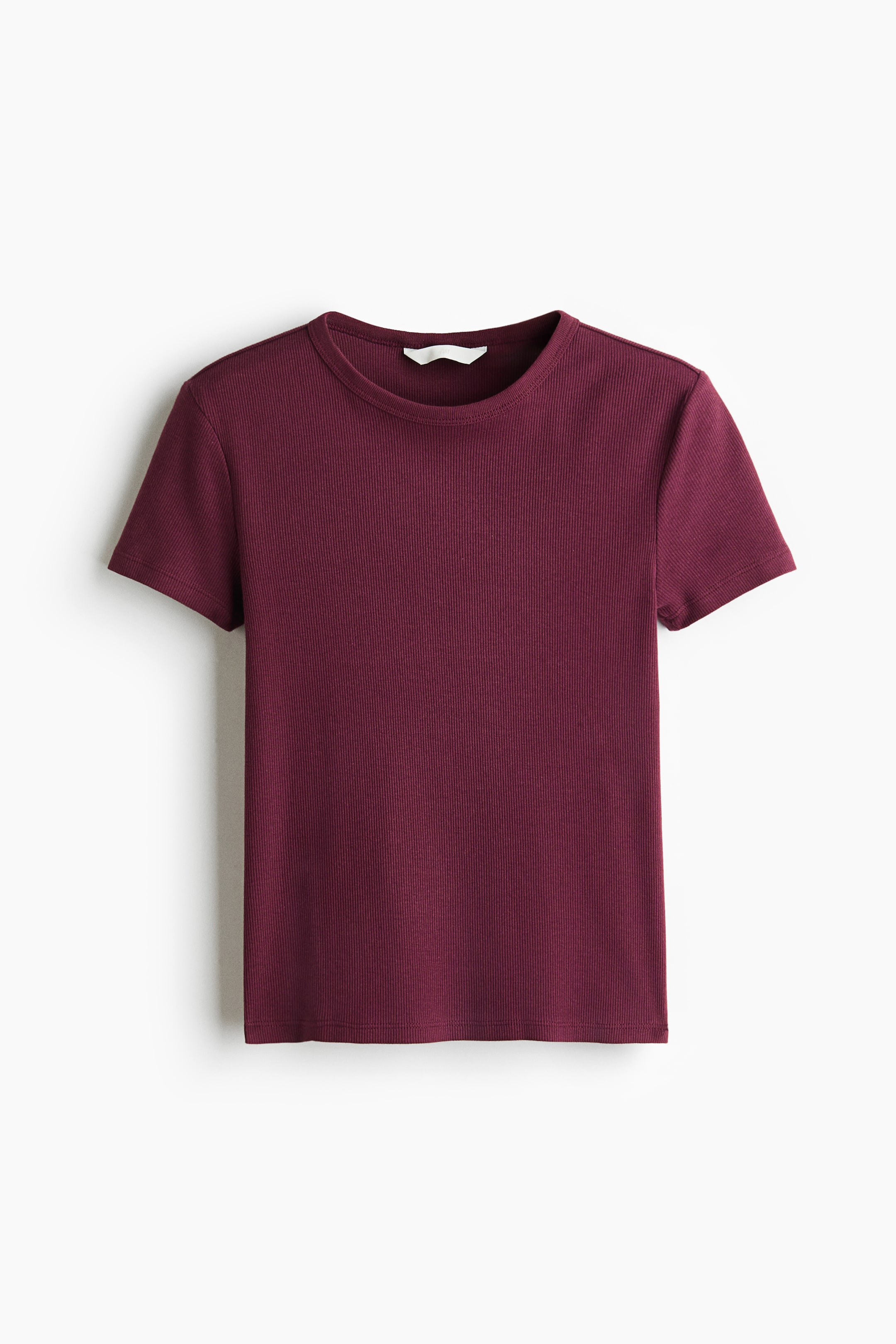 View larger image: A fitted T-shirt in dark red ribbed cotton jersey is displayed from the front. It features a narrow trim around its round neckline, short sleeves, and a straight-cut hem.
