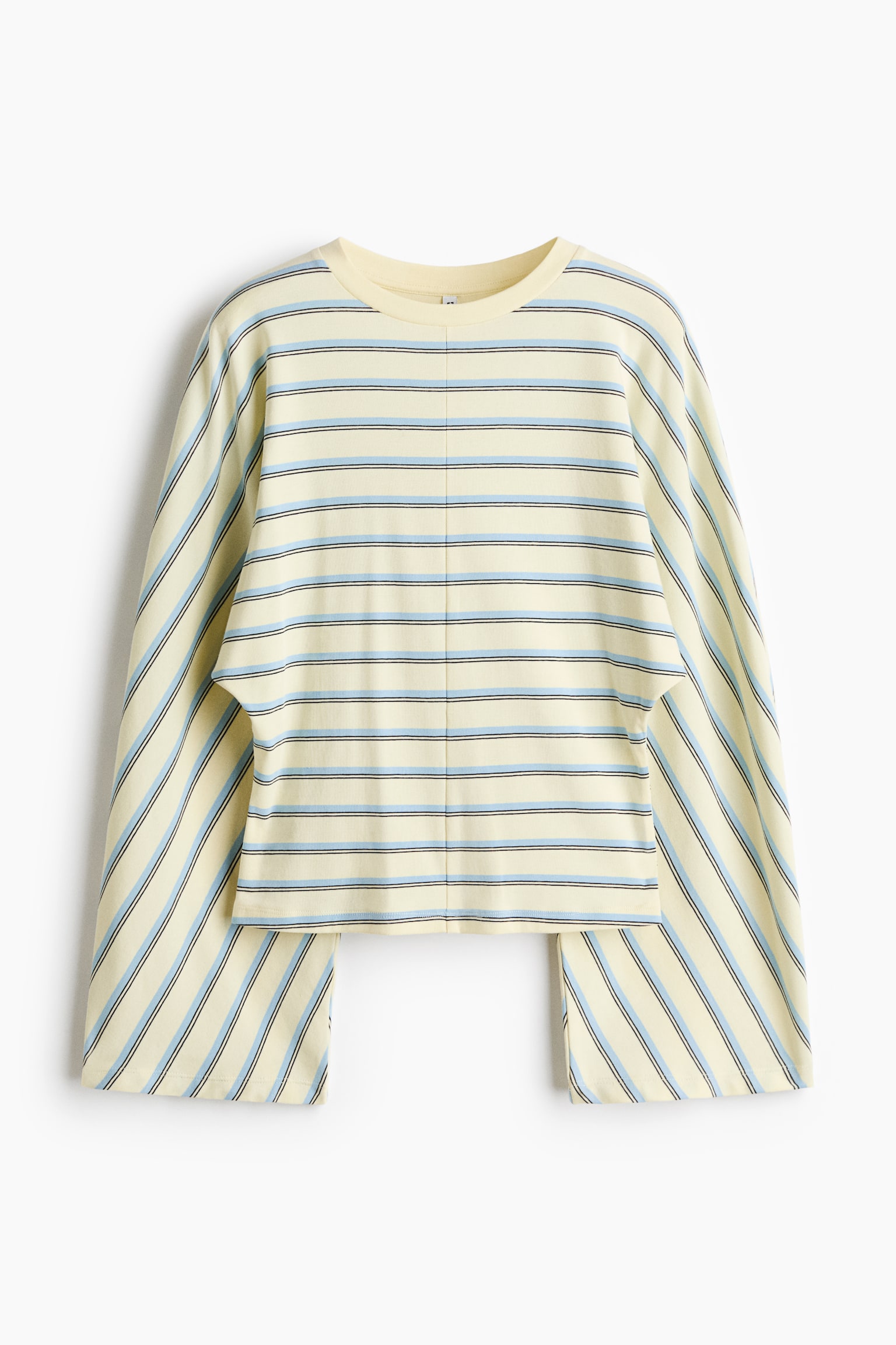 The front-facing long-sleeved top showcases a cropped silhouette in pale yellow, patterned with horizontal light blue and dark stripes across the body and diagonal stripes on the wide, draped sleeves. It features a ribbed crew neck and a vertical seam running down the centre front.
