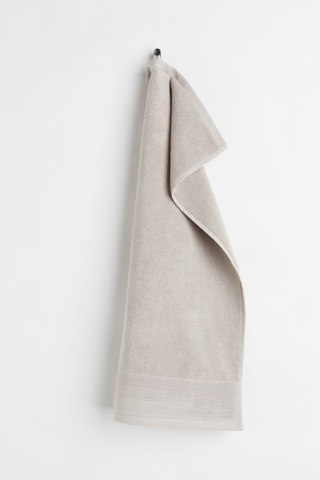 Handtuch aus Baumwollfrottee - Helles Taupe/Schwarz - 1