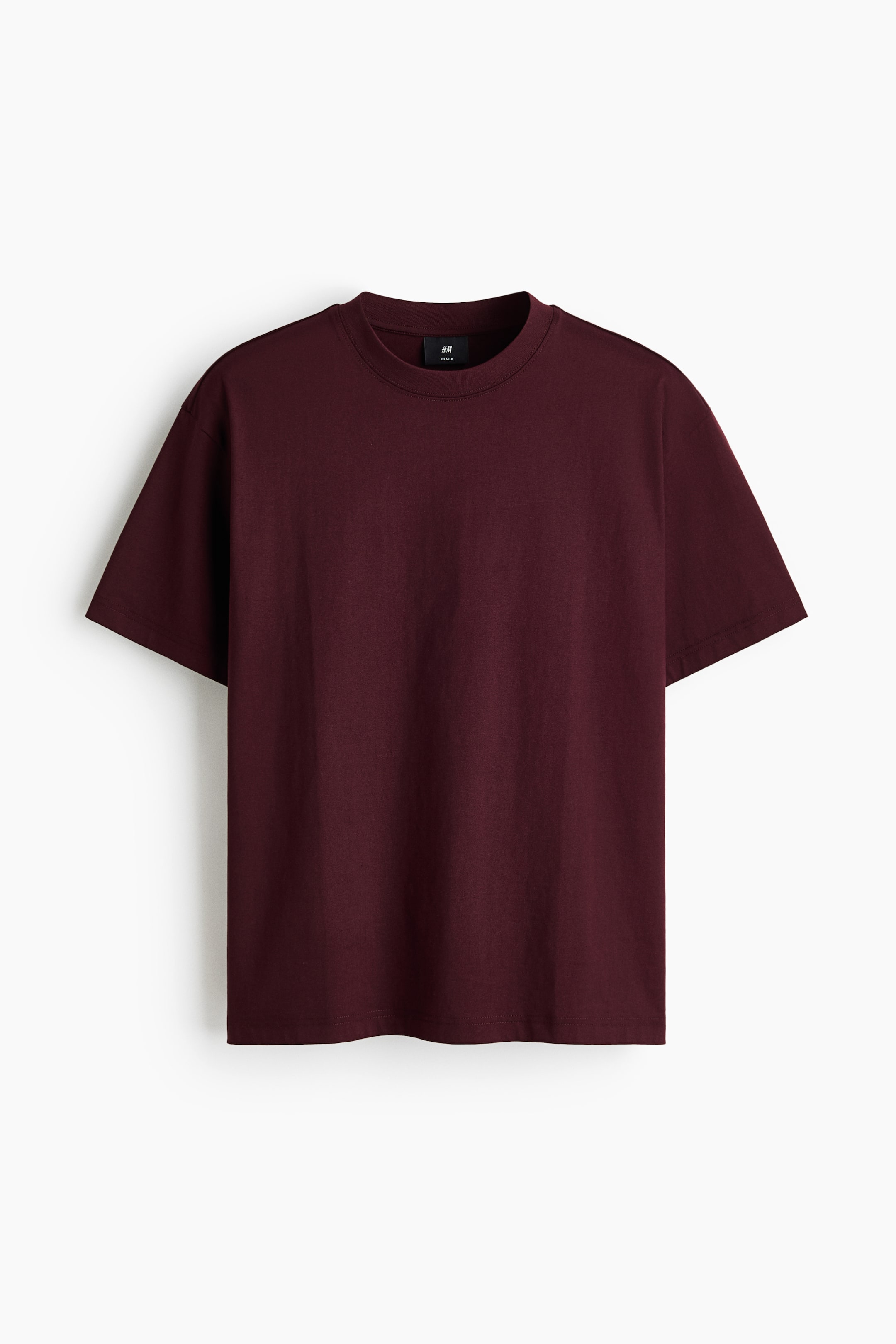 View larger image: A deep red midweight cotton jersey T-shirt is showcasing its front view, featuring a round, ribbed neckline, dropped shoulders, and a straight-cut hem, offering a relaxed fit with a roomy yet not oversized silhouette.