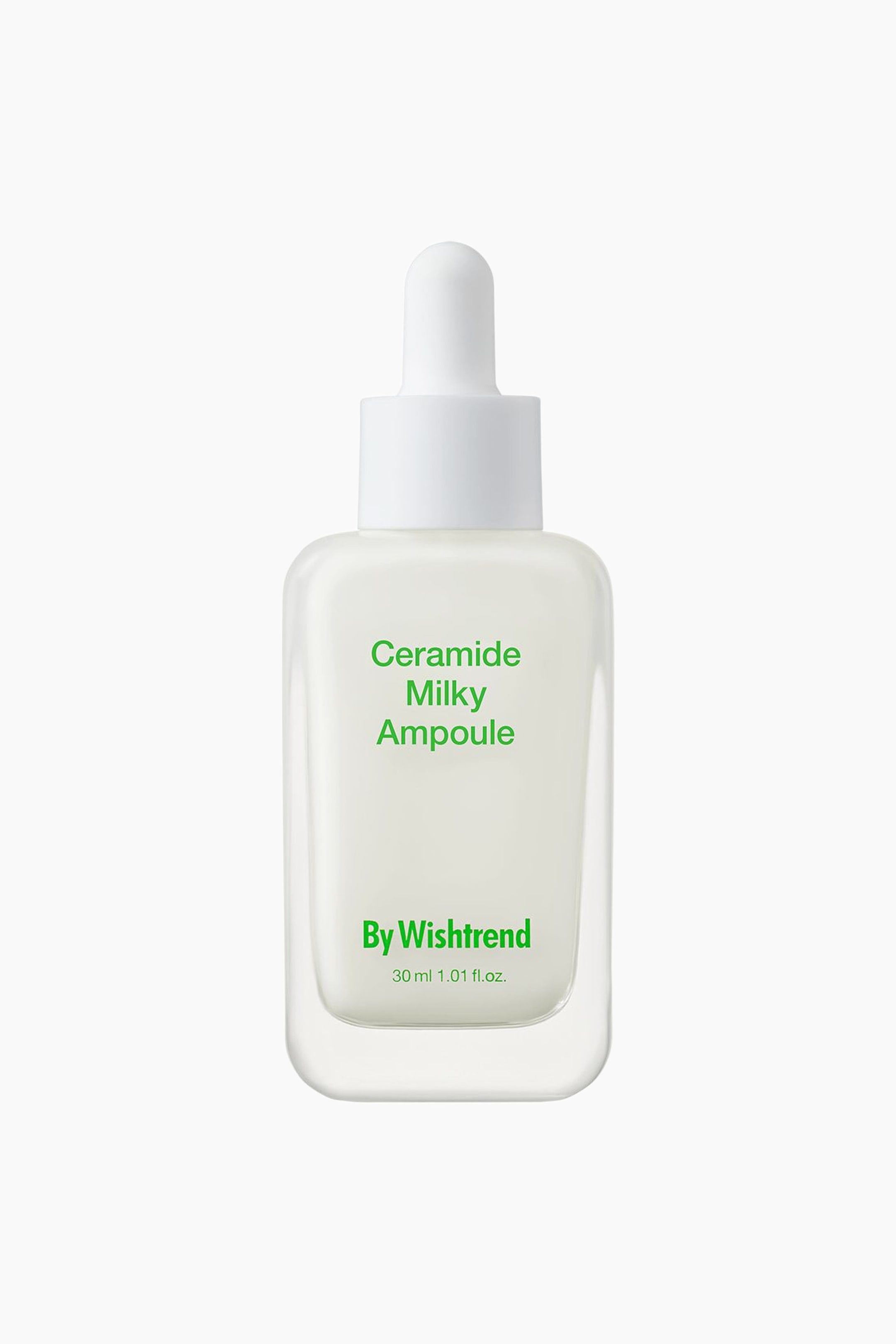 Se større billede: En rektangulær, klar glasflaske fyldt med en mælkehvid væske er forsynet med en hvid pipettehætte. Flasken viser grøn tekst, der lyder "Ceramide Milky Ampoule," "By Wishtrend," og "30 ml 1.01 fl.oz."