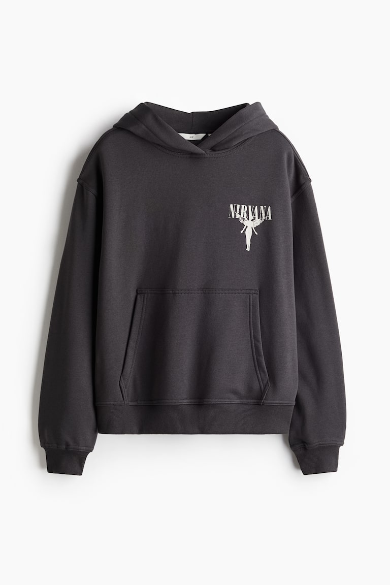 The Story and Meaning Behind Nirvana's Infamous Smiley Face Logo - American  Songwriter, image size:768x1152