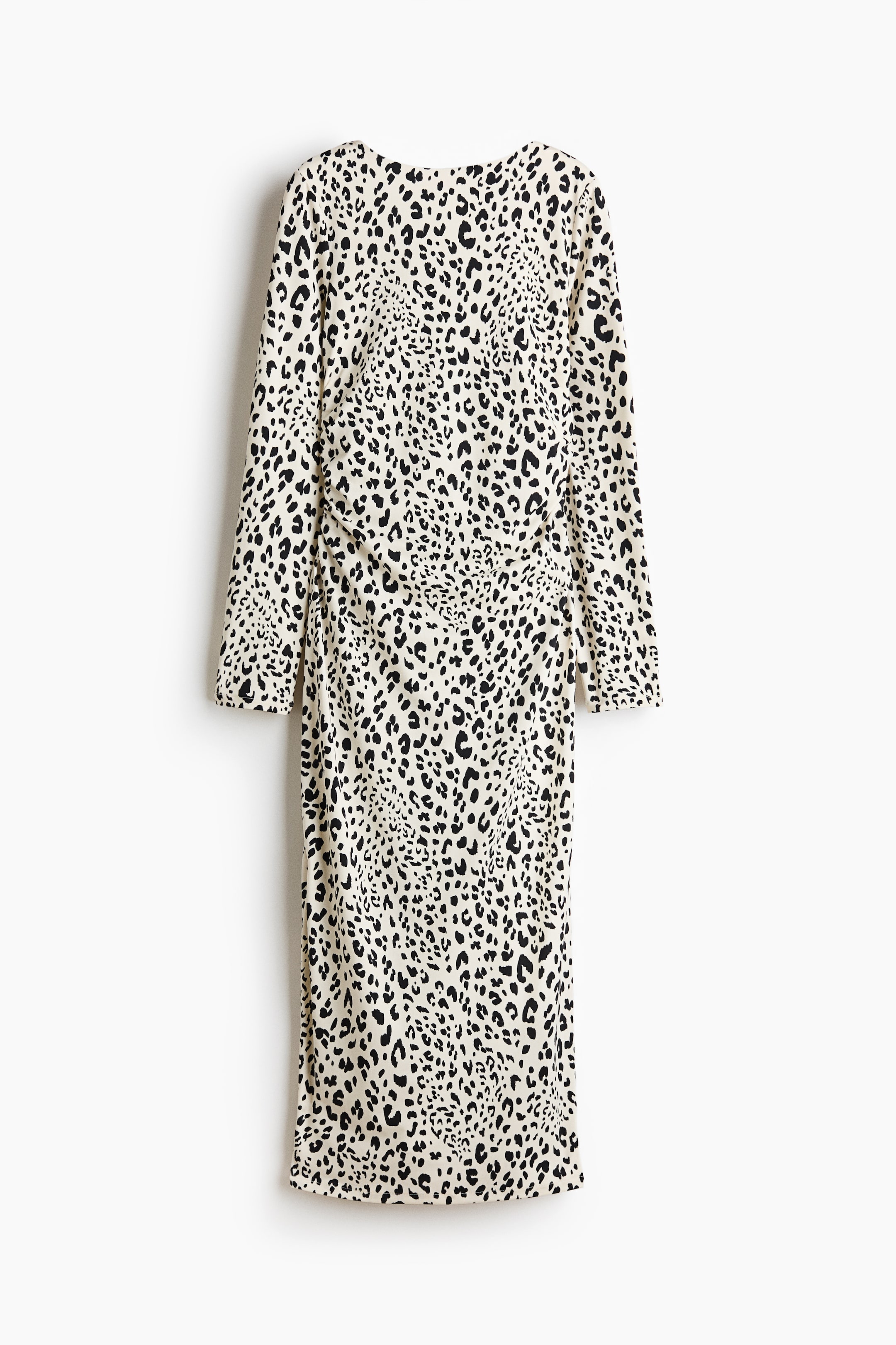 View larger image: The back of a midi dress features a black leopard print on an off-white background. It has long sleeves and a round back neckline. Ruching on the left side of the torso creates a draped effect.