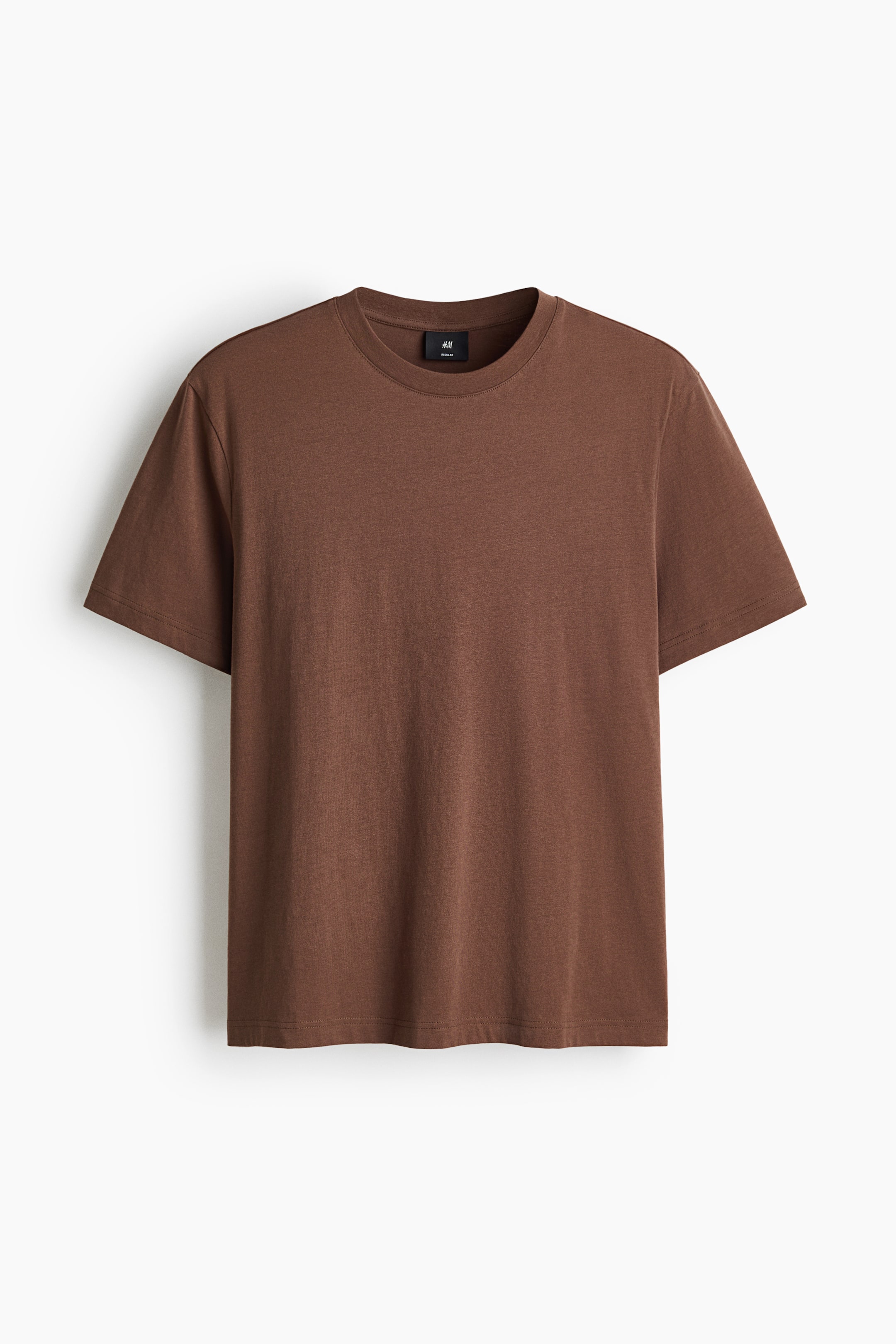 View larger image: A brown t-shirt is facing forward, showcasing a round, rib-trimmed neckline. It's crafted from lightweight cotton jersey, featuring short sleeves, a straight-cut hem, and a regular fit.