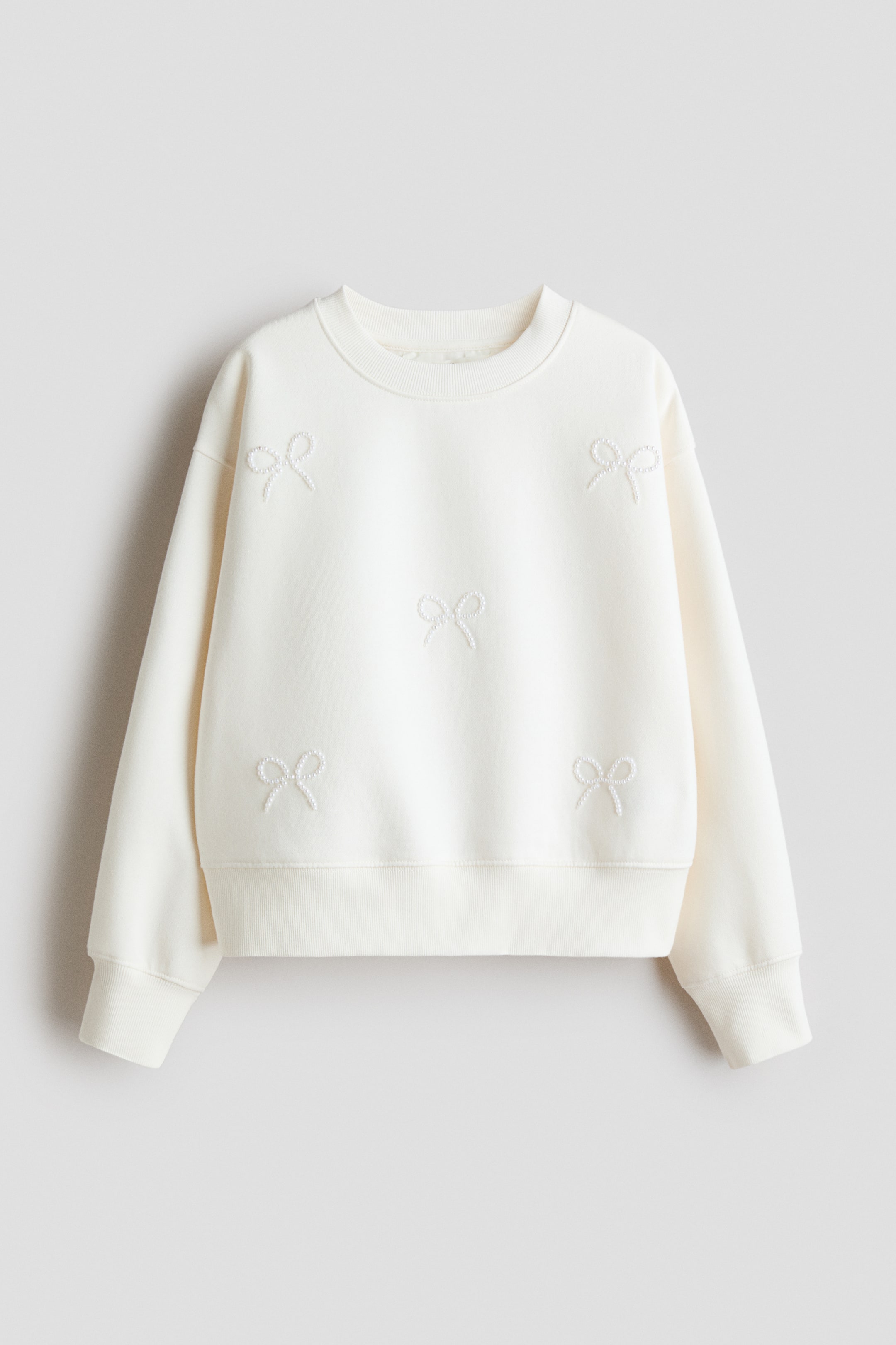 View larger image: Motif-detail sweatshirt - White/Bows - Kids | H&M 1