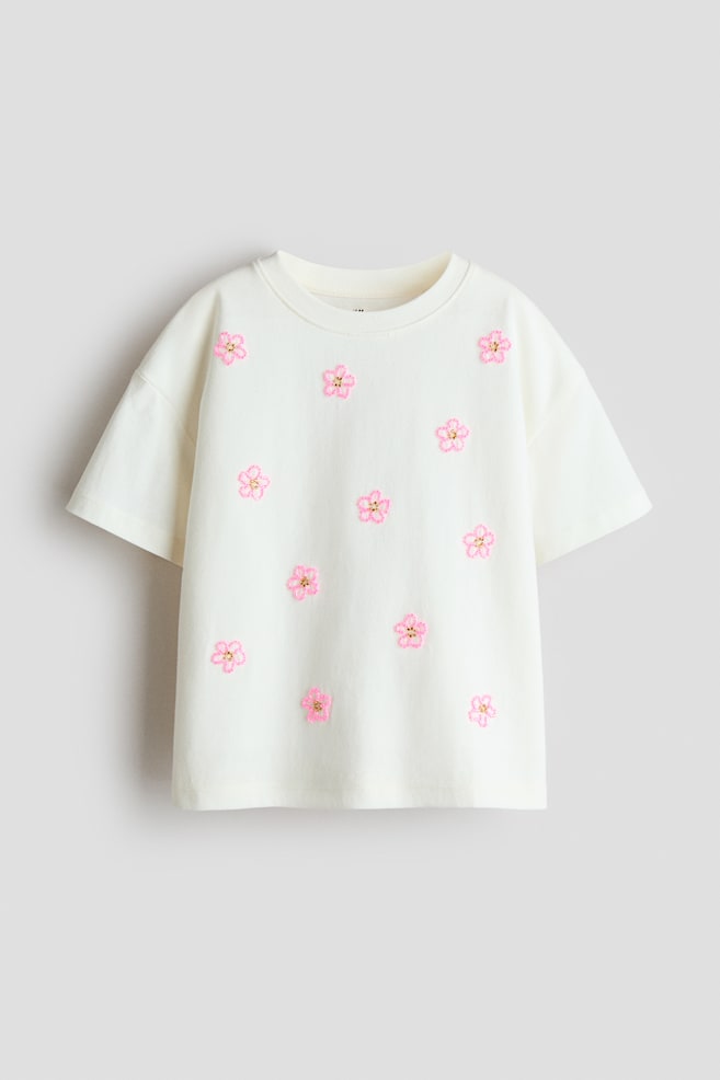Appliquéd cotton T-shirt - Ivory/Flowers/Cream/Bow/White/Navy blue striped/Light pink/Striped/Ivory/Spread love/Light pink/Bows/Ivory/New York/Coral pink/Le Marais - 1