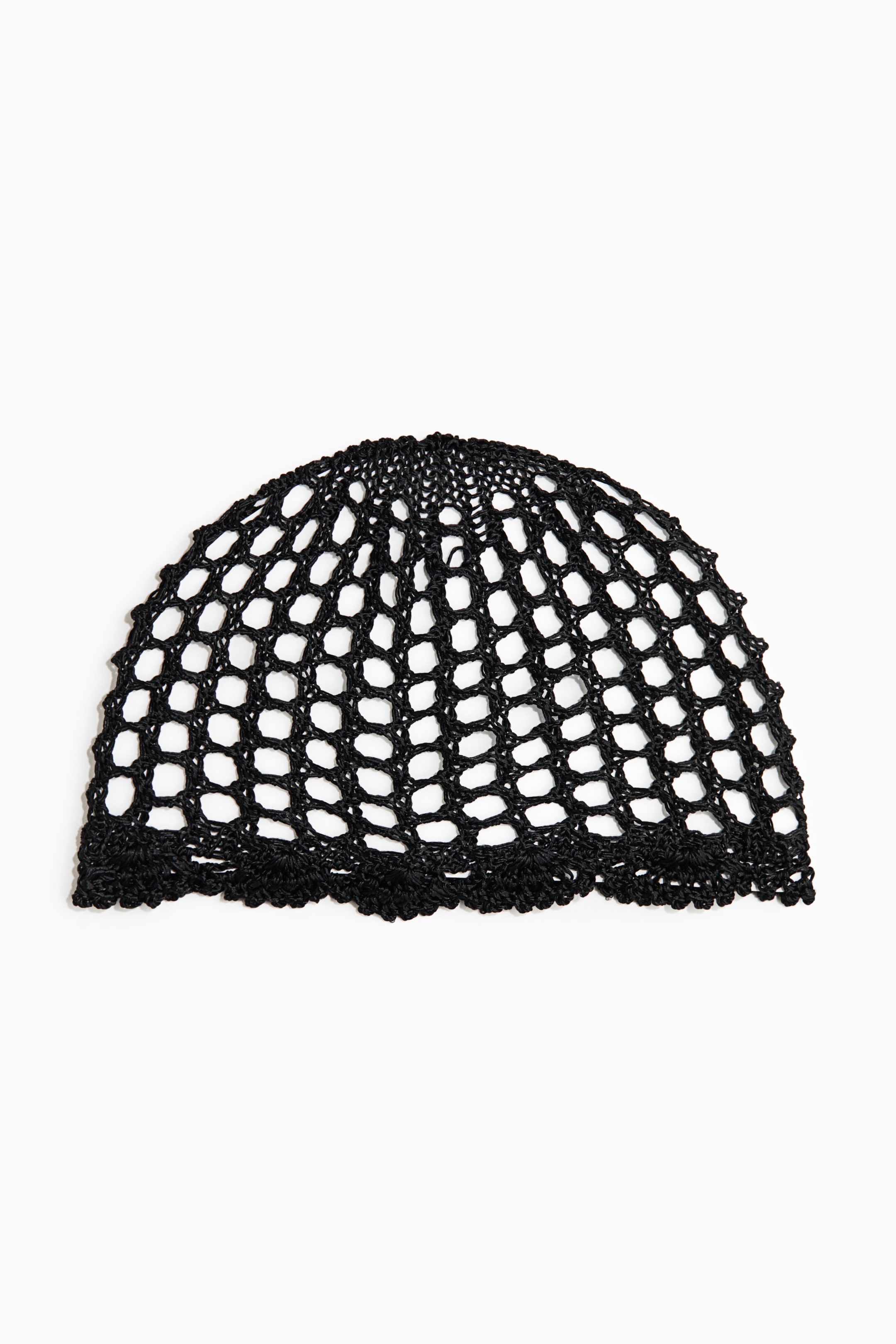 View larger image: A black crocheted cap showcases a wide mesh pattern and features a decorative, scalloped border along its lower edge.