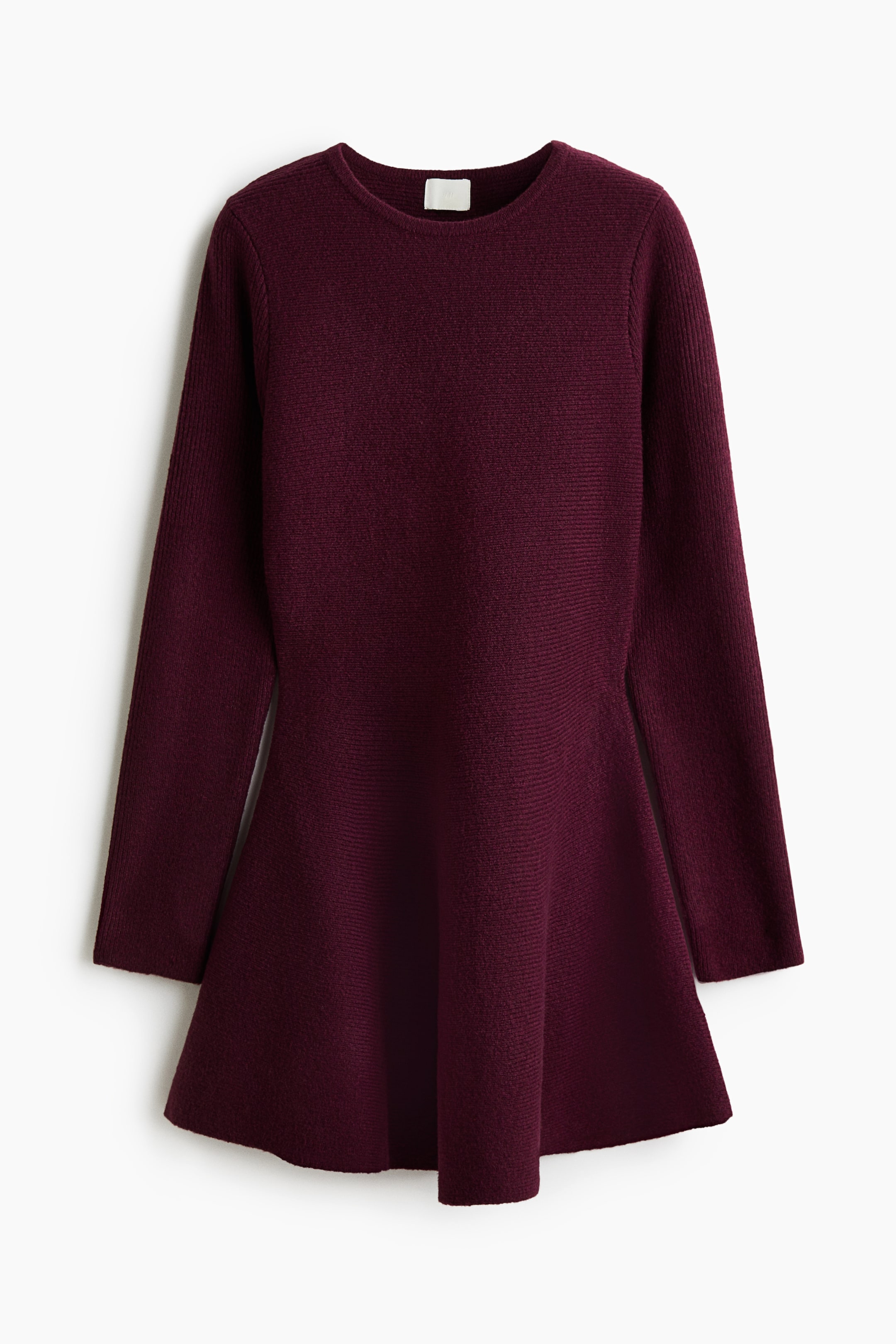 View larger image: A short, dark plum-coloured dress is shown facing front, featuring a horizontal rib-knit texture, a round neckline, and long sleeves. The design showcases a fitted bodice that transitions into a flared A-line skirt.